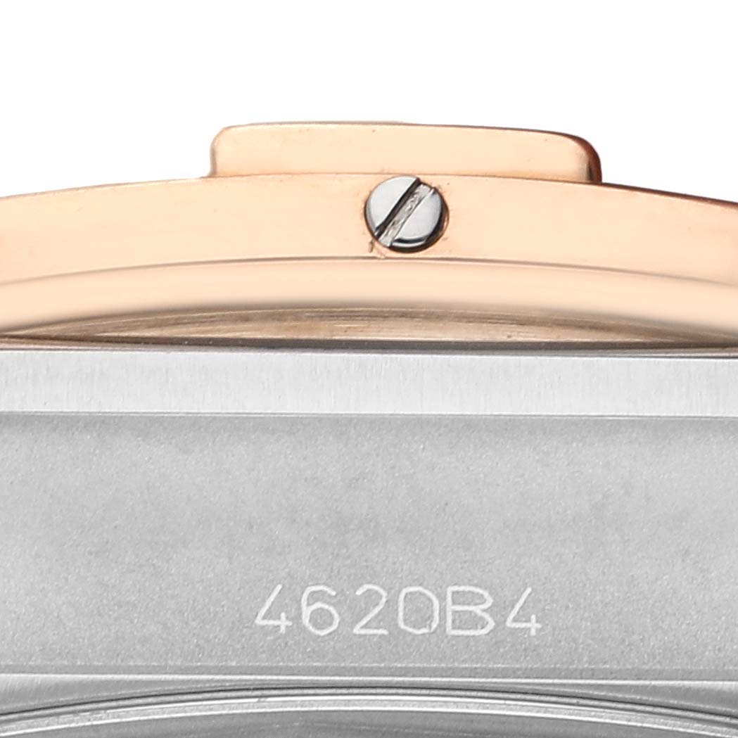 This close-up image of the Breitling Chronomat UB0134 Men's Steel and Gold (two tone) Grey Dial UB0134 Men's Steel and Gold (two tone) Grey Dial watch shows the side profile, highlighting the bezel screw and part of the case with serial number 4620B4.