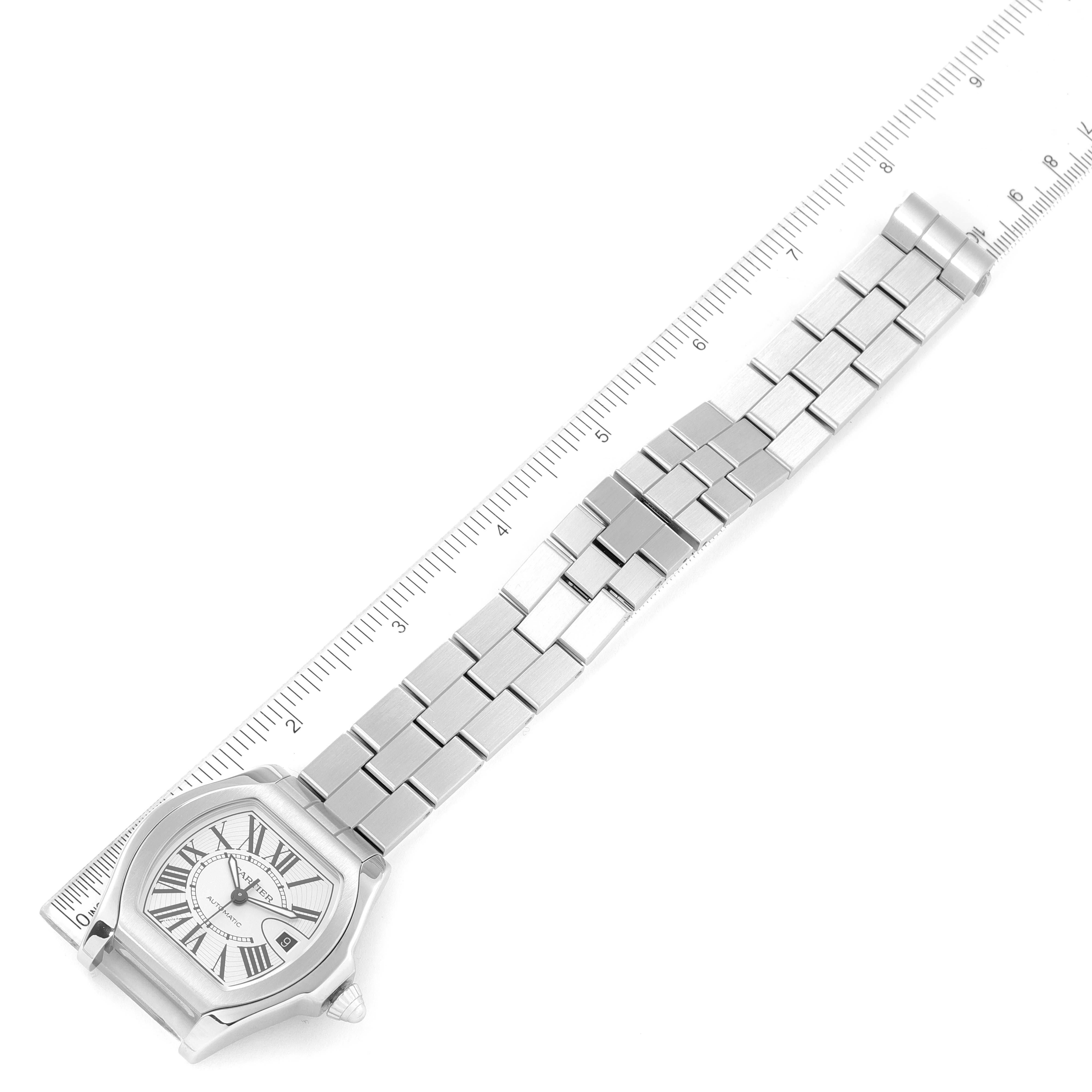This image shows the face and metal bracelet of the Cartier Roadster W6206017 Men's Stainless Steel Silver Dial W6206017 Men's Stainless Steel Silver Dial watch, displayed alongside a ruler for scale.