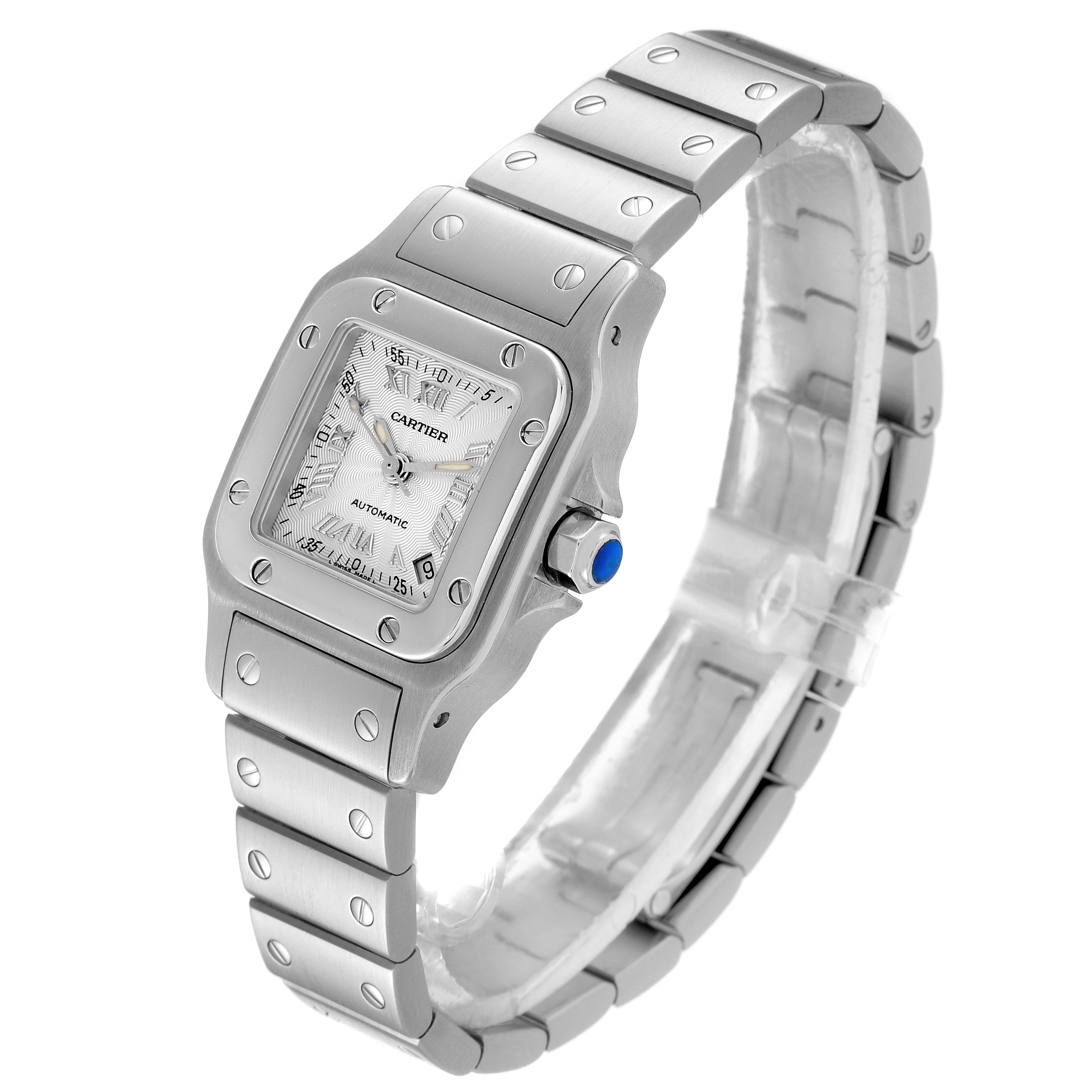 The image shows a side angle of a Santos model watch by Cartier, highlighting the watch face, bezel, crown, and bracelet.