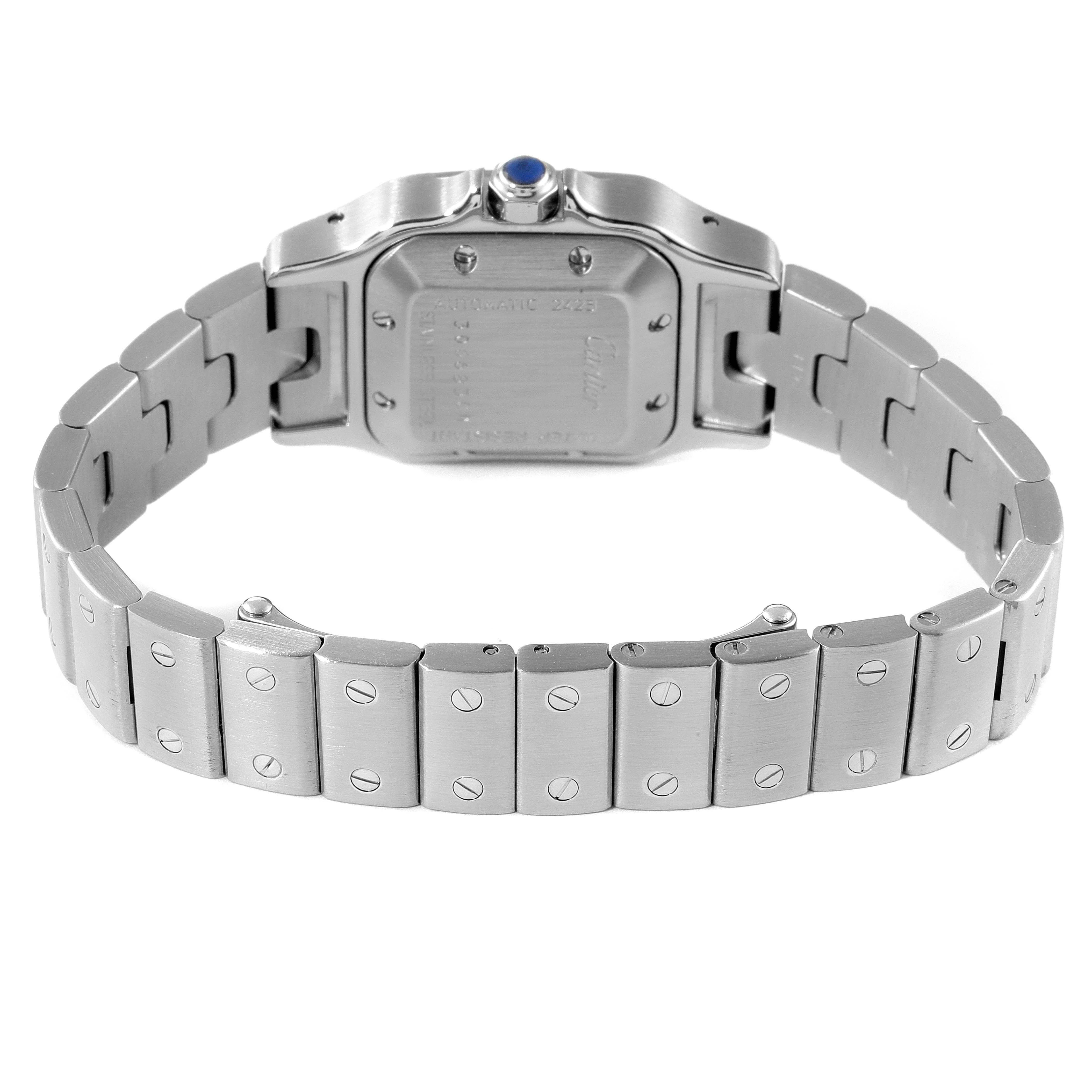 The image shows the back angle of the Santos model by Cartier, highlighting the case back, bracelet, and clasp.