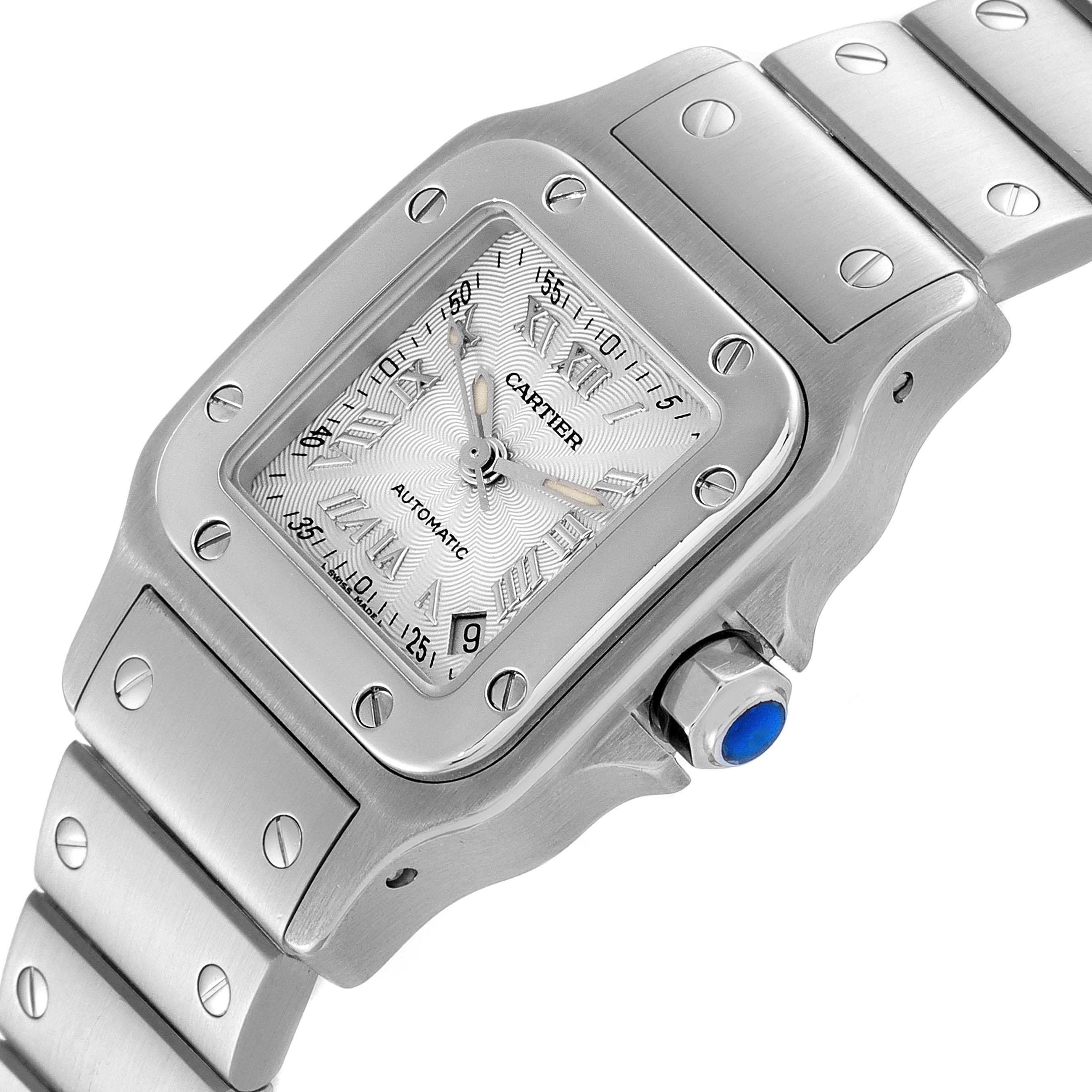 The Cartier Santos W20044D6 Women's Stainless Steel Silver Dial W20044D6 Women's Stainless Steel Silver Dial watch is shown in a close-up angle, highlighting its face, bezel, crown, and part of the bracelet.