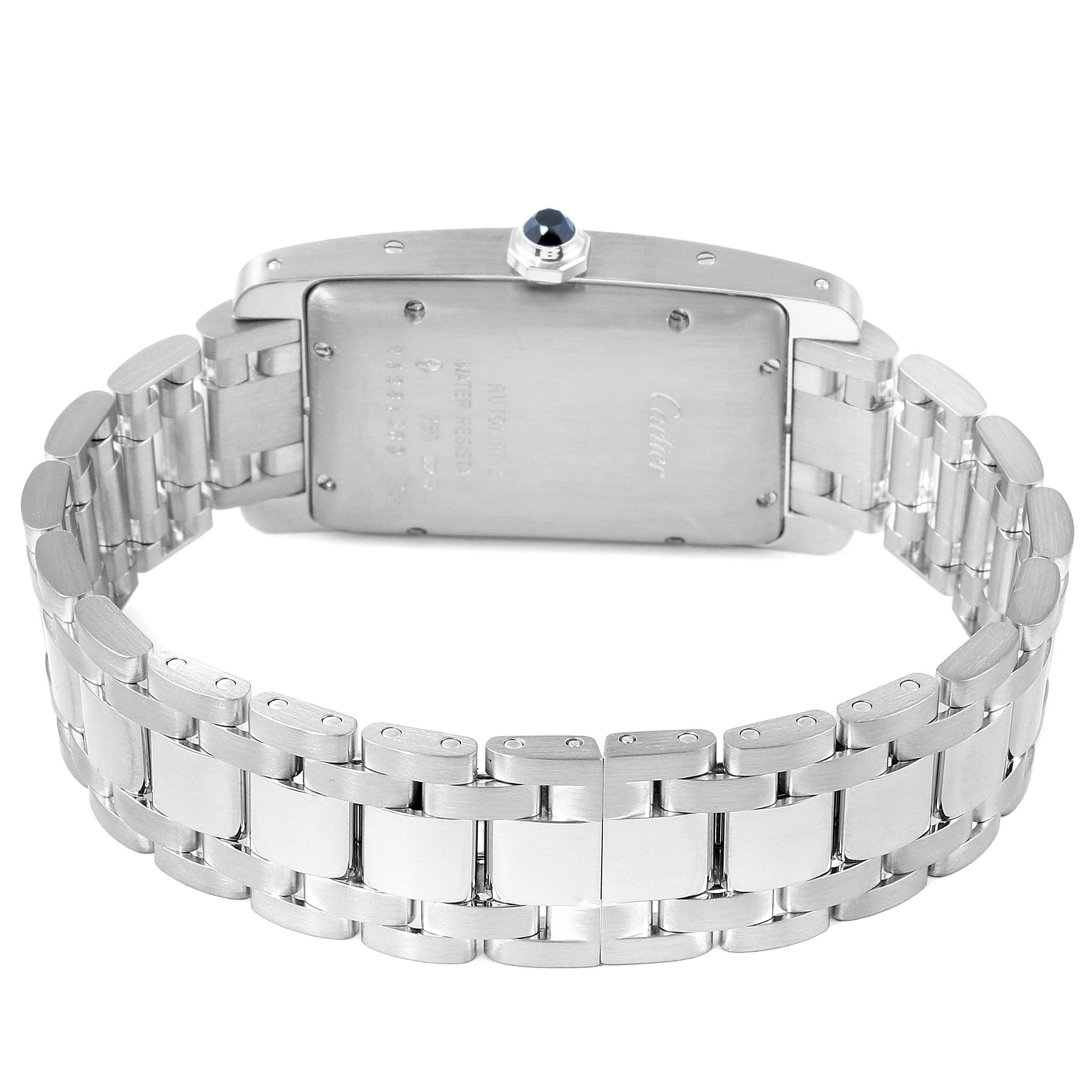 The image shows the rear view of a Cartier Tank Américaine watch, highlighting the case back, bracelet, and crown.