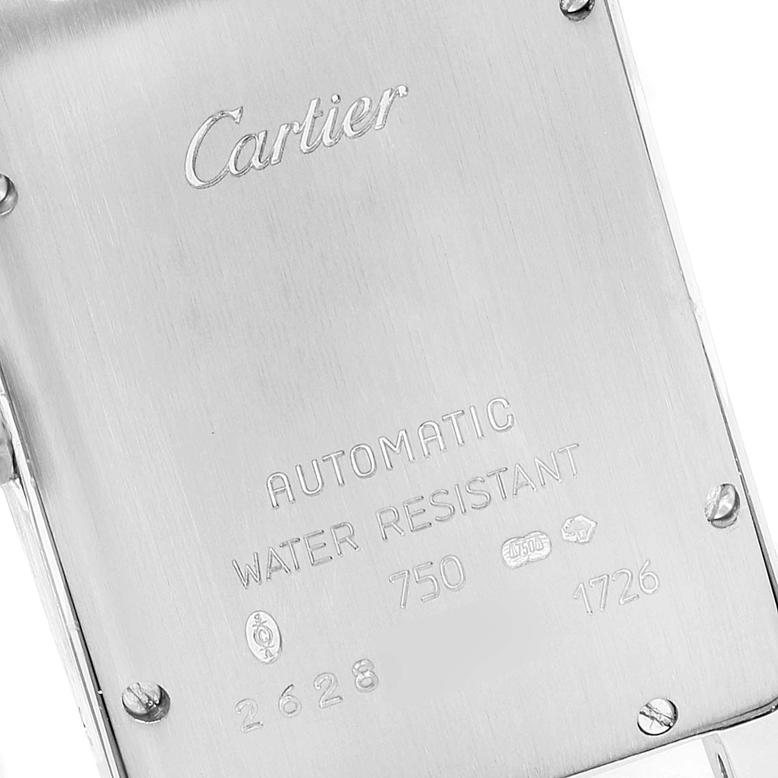 This image shows the back plate of the Cartier Tank Americaine W26036L1 Women's White Gold Silver Dial W26036L1 Women's White Gold Silver Dial watch, highlighting its engraving and screws.