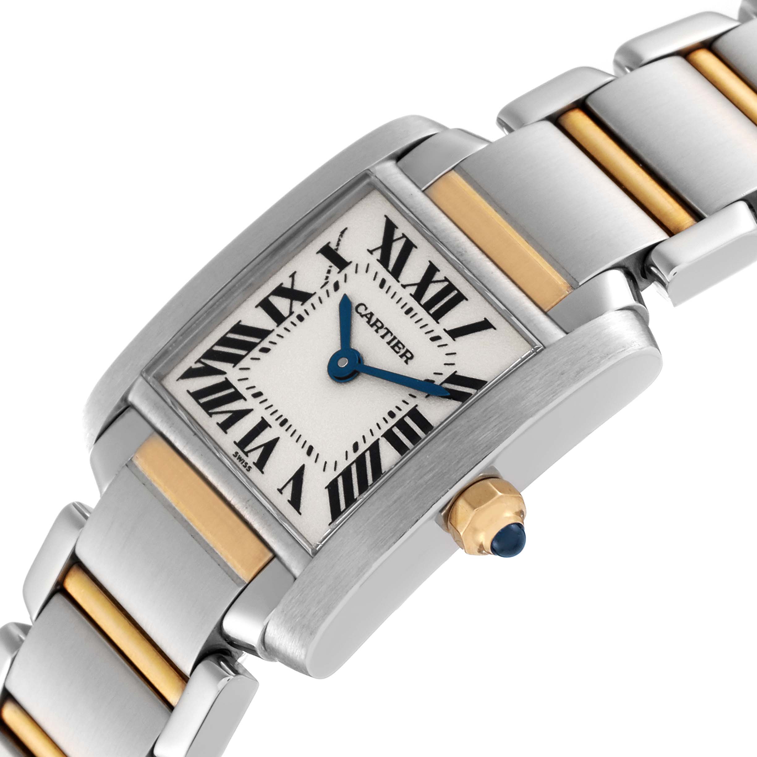 The image shows a close-up of the Cartier Tank Francaise W51007Q4 Women
s Steel and Gold (two tone) Silver Dial W51007Q4 Women
s Steel and Gold (two tone) Silver Dial watch, displaying its dial, crown, and part of the bracelet.