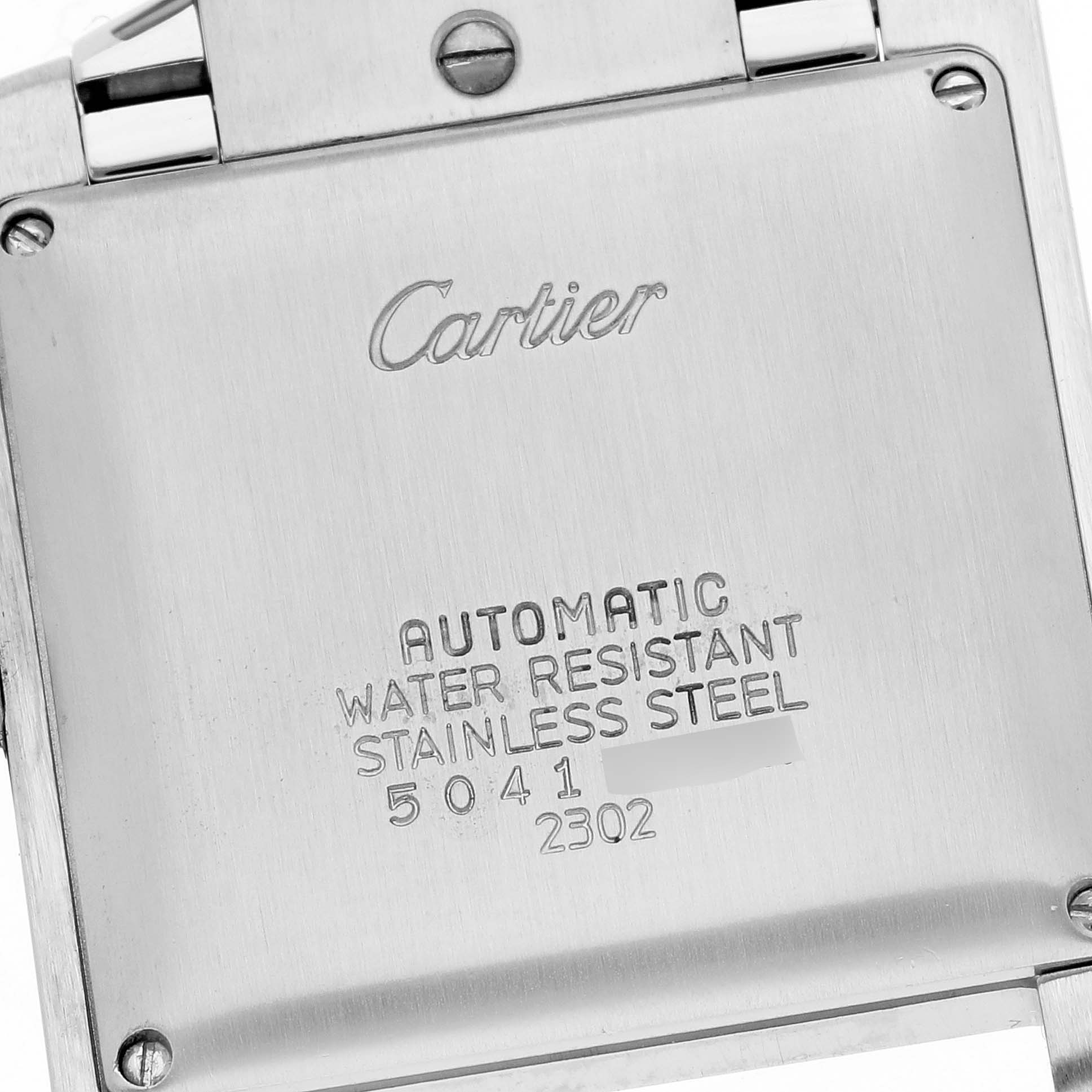 The image shows the back casing of a Tank Francaise model by Cartier displaying the brand name and specifications.