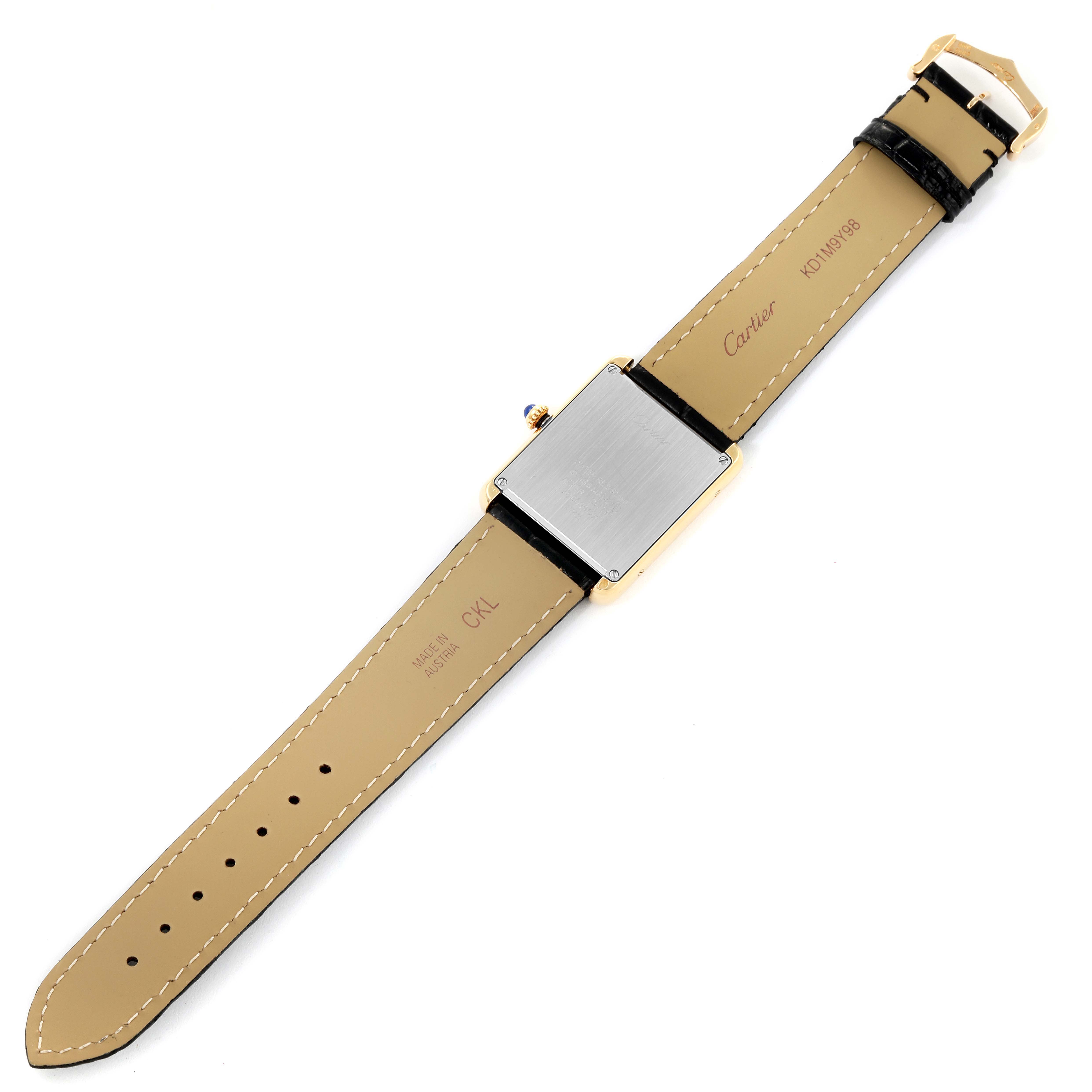 The Cartier Tank Solo W1018855 Men
s Steel and Gold (two tone) Silver Dial W1018855 Men
s Steel and Gold (two tone) Silver Dial watch is shown from the back, displaying the strap, buckle, and case back.