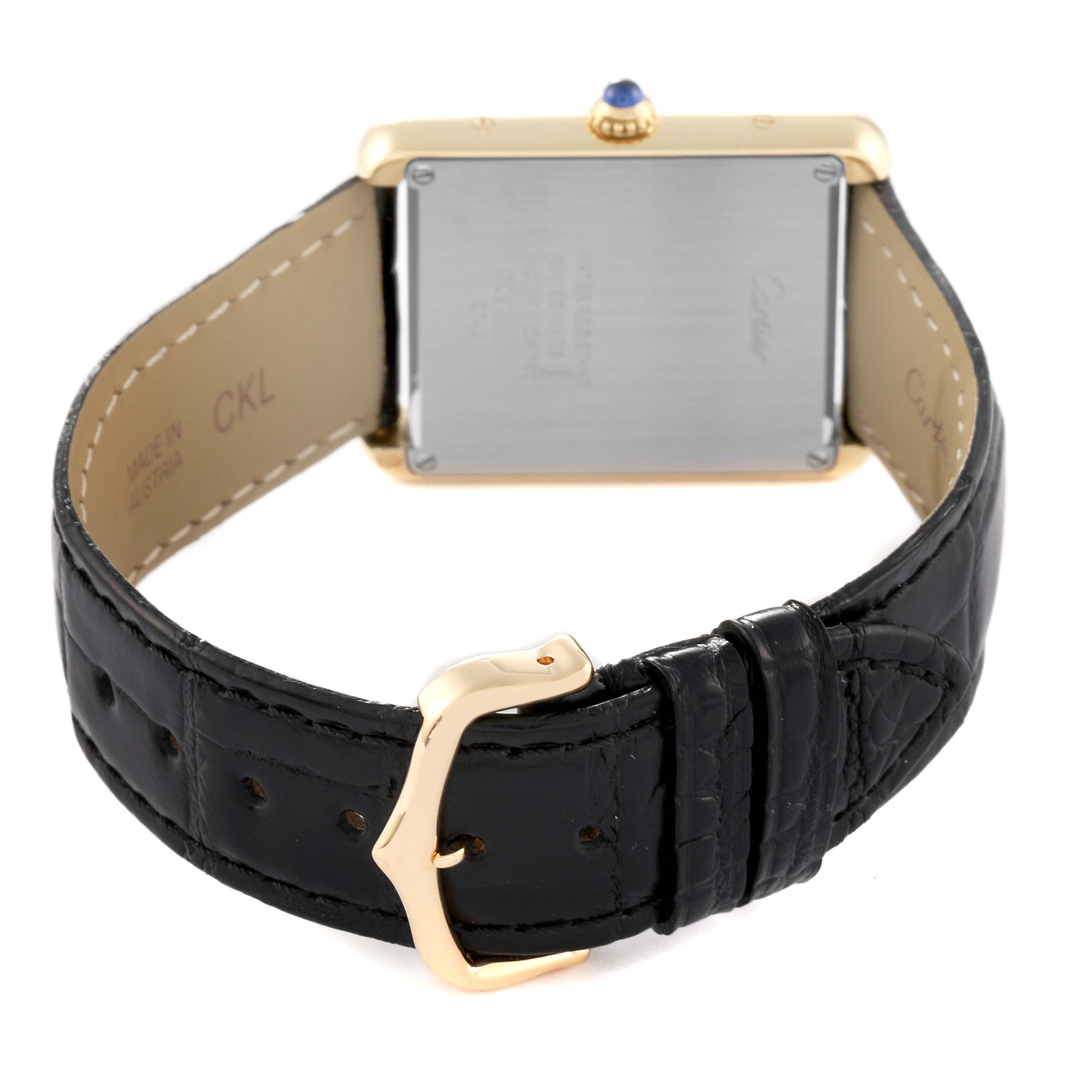 The image shows the back view of a Cartier Tank Solo W1018855 Men
s Steel and Gold (two tone) Silver Dial W1018855 Men
s Steel and Gold (two tone) Silver Dial watch, highlighting the buckle and black leather strap.