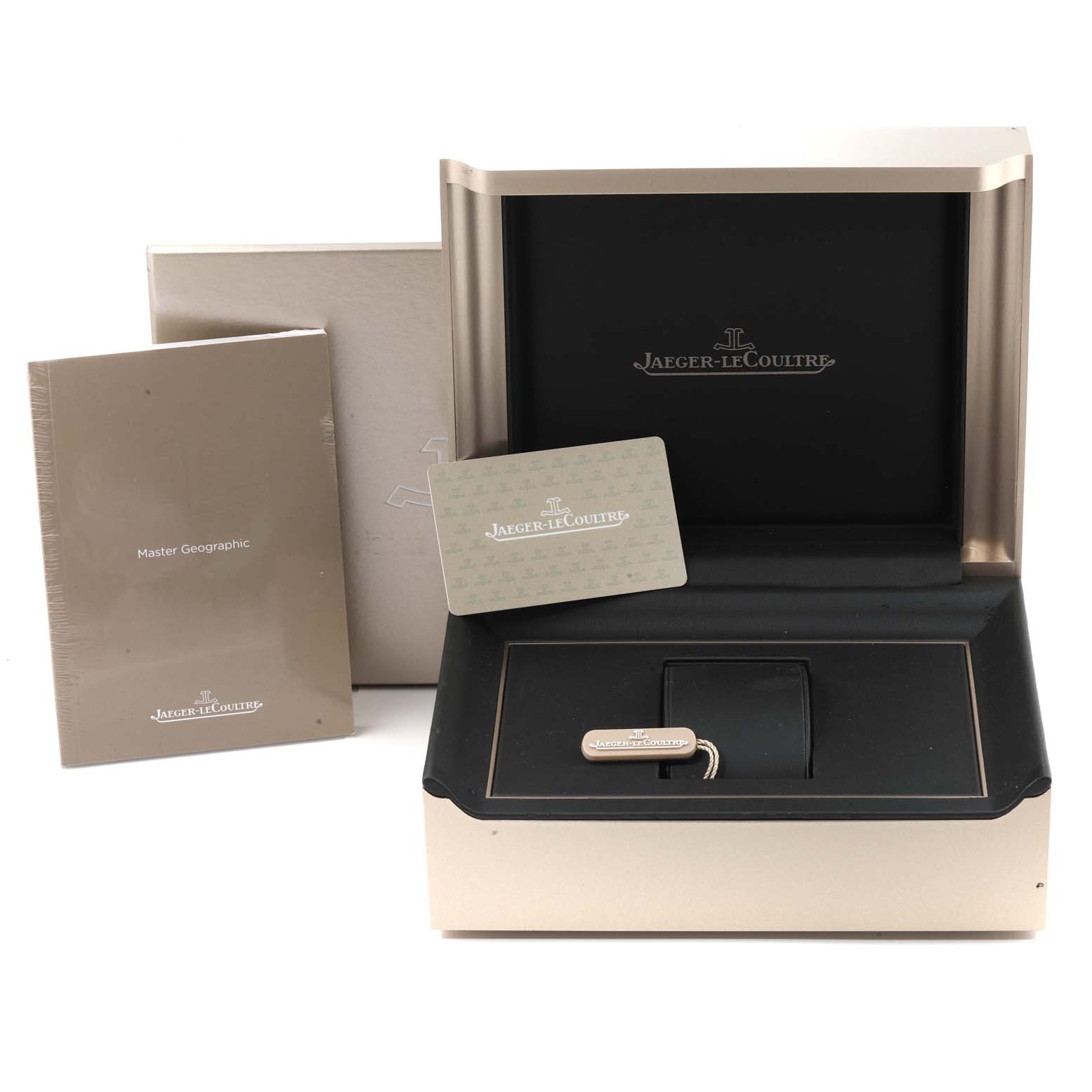 The image shows the box, booklet, card, and tag for the Jaeger-LeCoultre Master Geographic watch model.