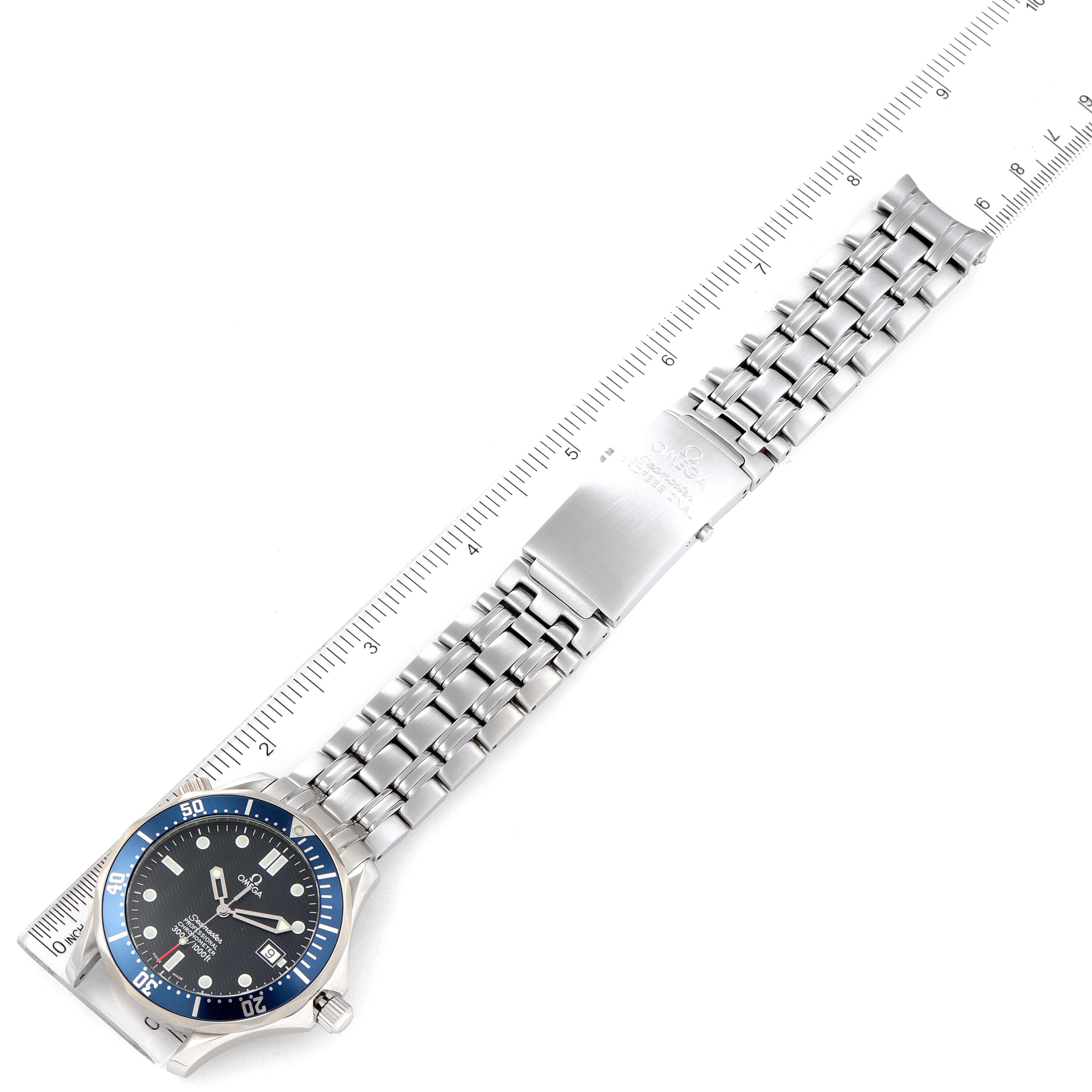 The image shows an Omega Seamaster 2531.80.00 Men's Stainless Steel Blue Dial 2531.80.00 Men's Stainless Steel Blue Dial watch laid flat with an extended metal bracelet, alongside a ruler for size reference.