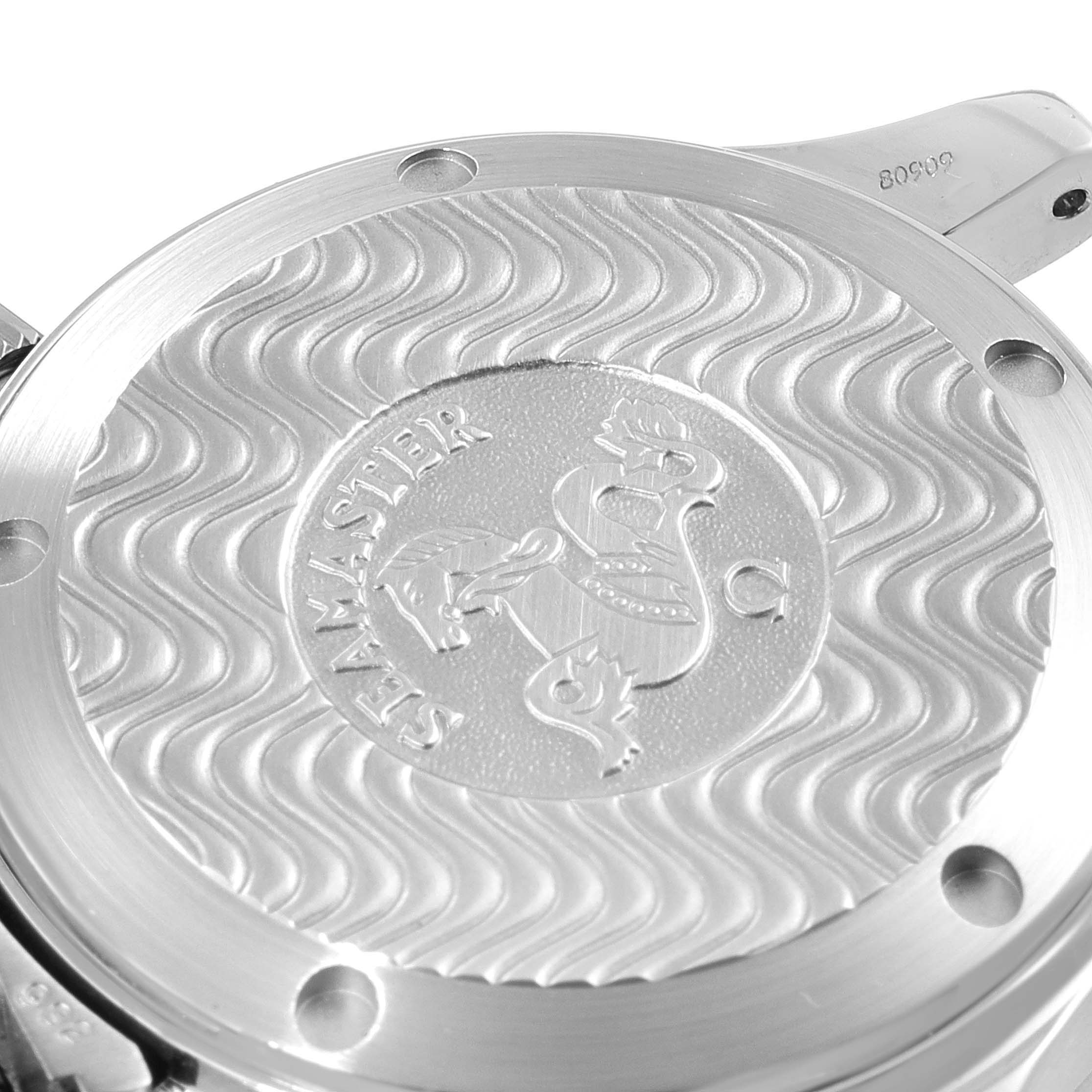 The image depicts the back case of an Omega Seamaster 2252.50.00 Men's Stainless Steel Black Dial 2252.50.00 Men's Stainless Steel Black Dial watch, showing engraved logo and wave-pattern design.