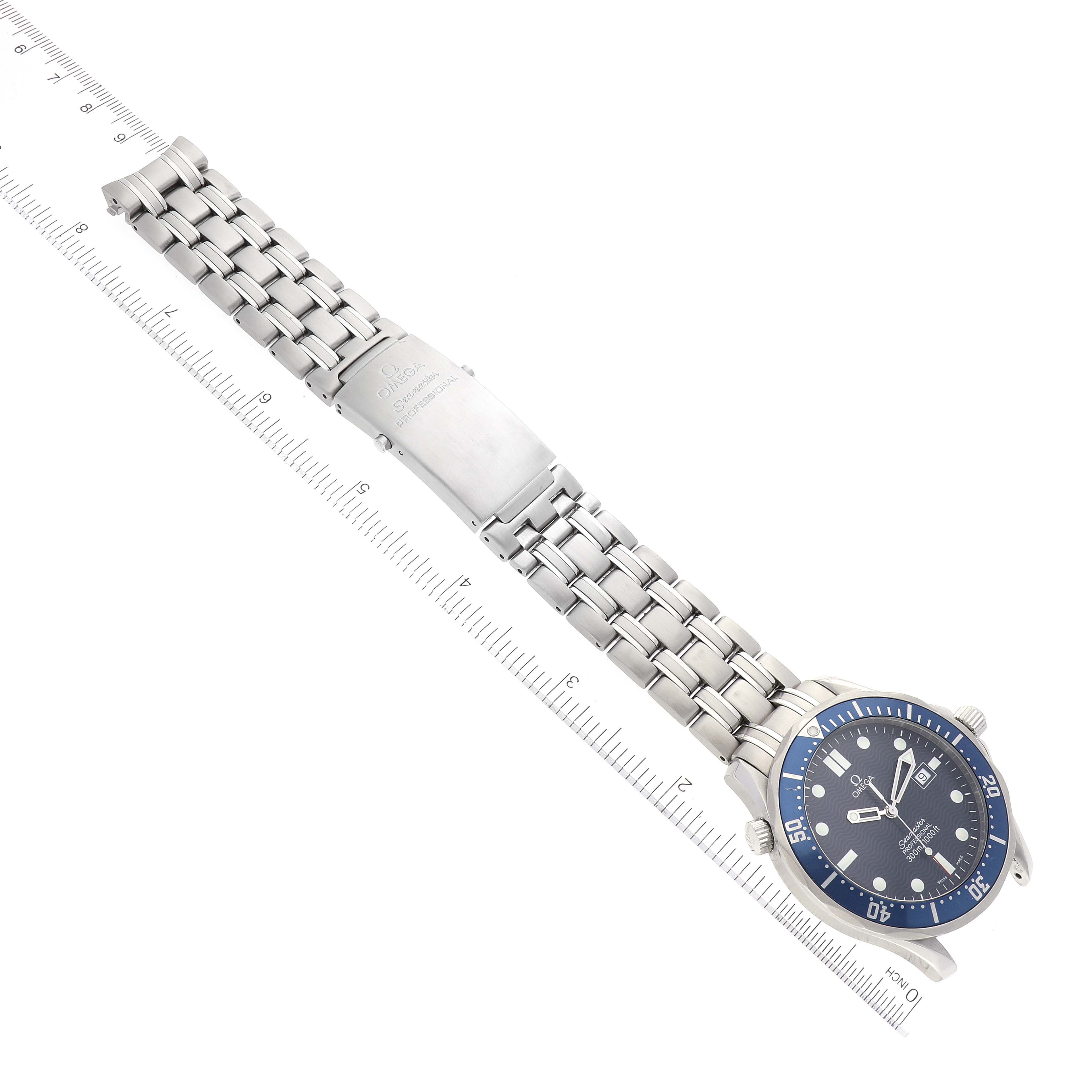The image shows the Omega Seamaster 2541.80.00 Men's Stainless Steel Blue Dial 2541.80.00 Men's Stainless Steel Blue Dial watch laid flat, displaying the bracelet, clasp, and watch face aligned next to a ruler.