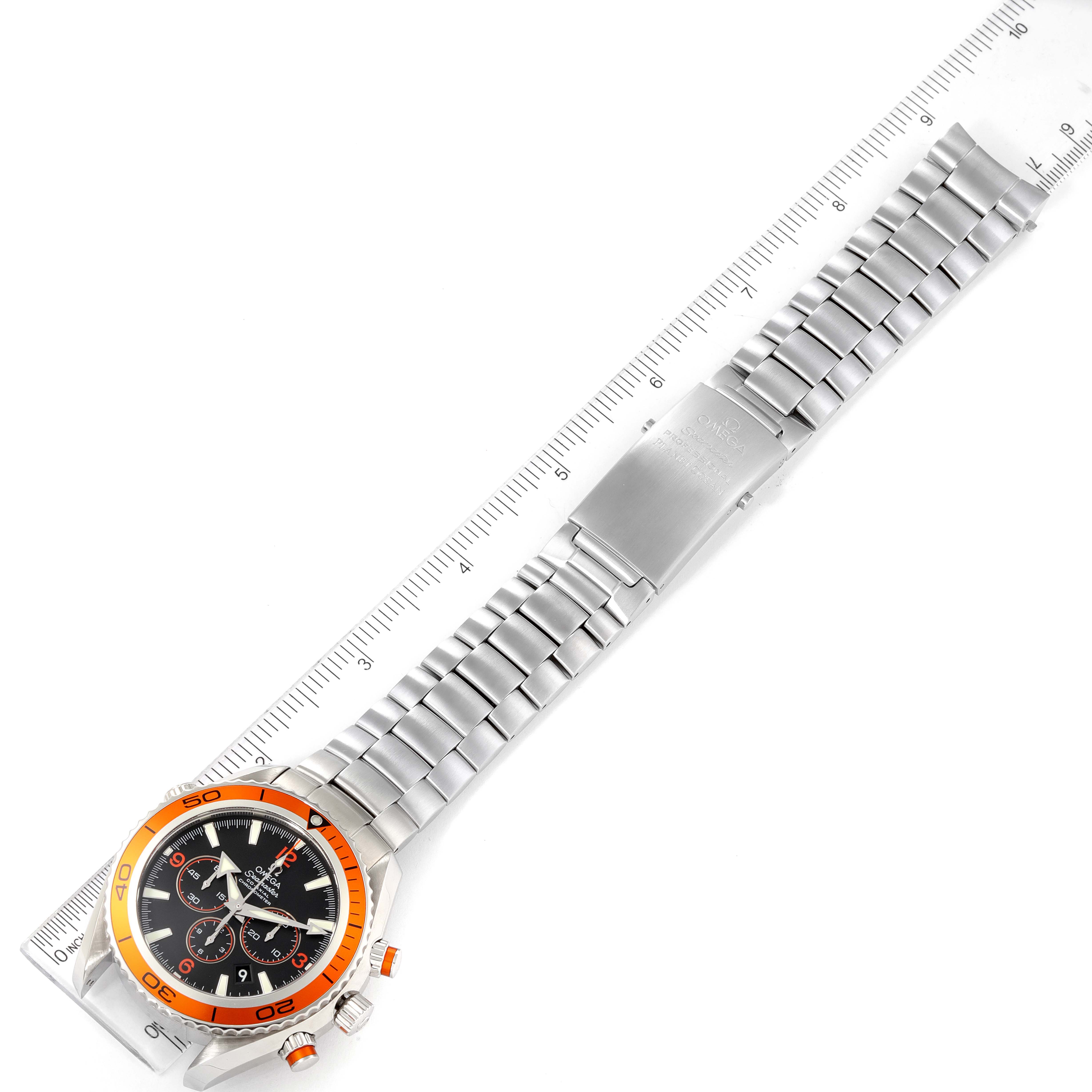 The Omega Planet Ocean 2218.50.00 Men's Stainless Steel Black Dial 2218.50.00 Men's Stainless Steel Black Dial watch is displayed flat, showing the face, bracelet, clasp, and a ruler for size reference.