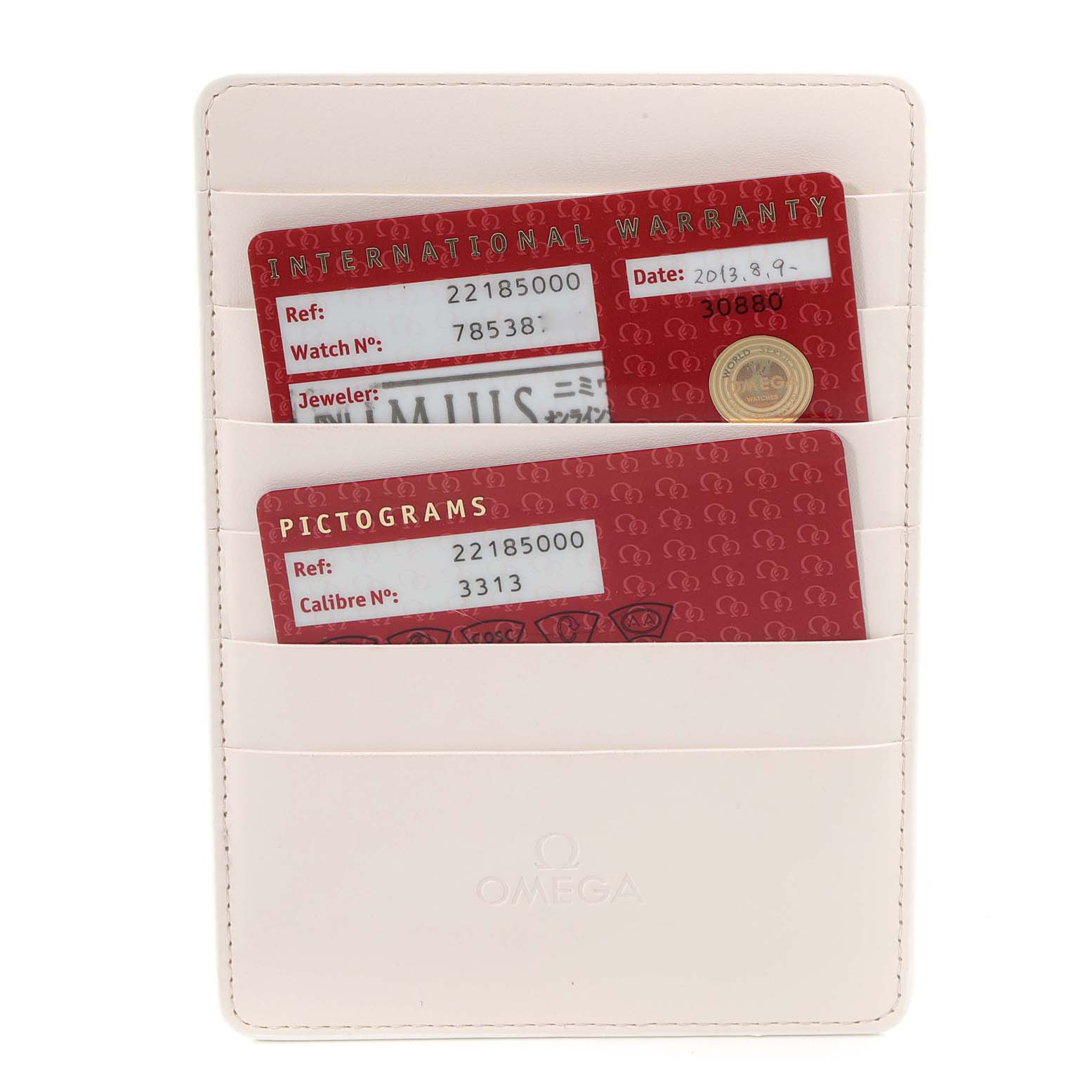 The image shows cards with warranty information and pictograms for an Omega Planet Ocean 2218.50.00 Men's Stainless Steel Black Dial 2218.50.00 Men's Stainless Steel Black Dial watch in a white cardholder.