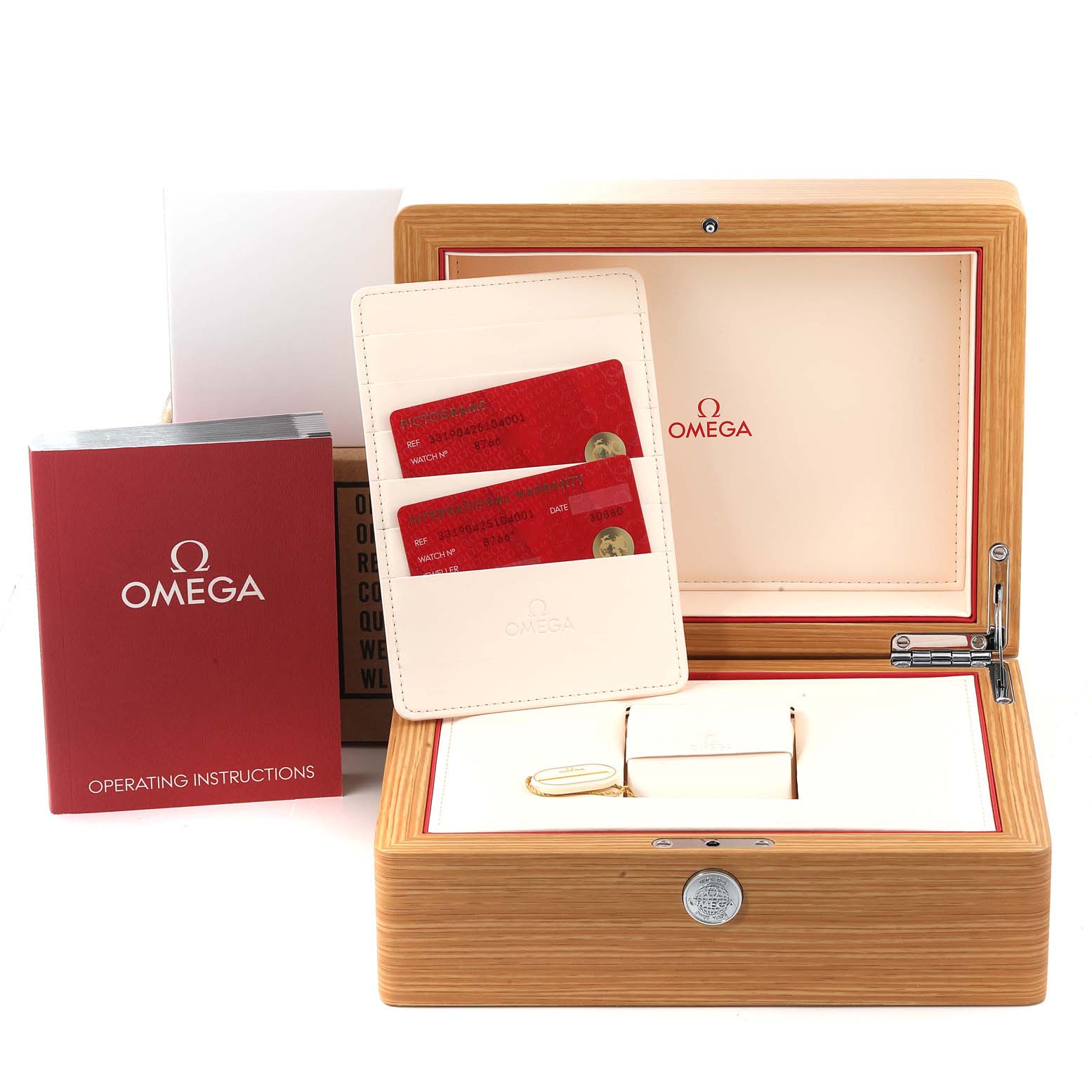 The image shows the packaging and accessories of an Omega Speedmaster 331.90.42.51.04.001 Men's Titanium White Dial 331.90.42.51.04.001 Men's Titanium White Dial watch, including a wooden box, instruction manual, and warranty cards.