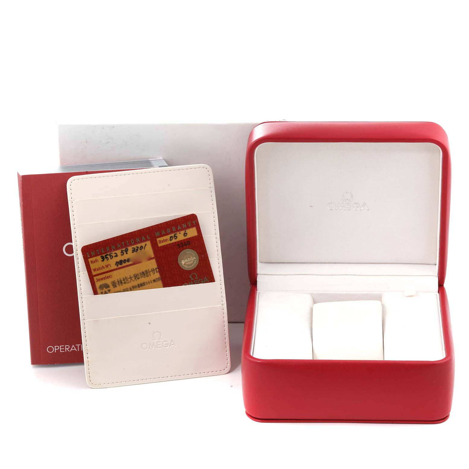 The image shows an Omega Speedmaster 3552.59.00 Men
s Stainless Steel Black Dial 3552.59.00 Men
s Stainless Steel Black Dial watch box, warranty card holder, and an operation manual.