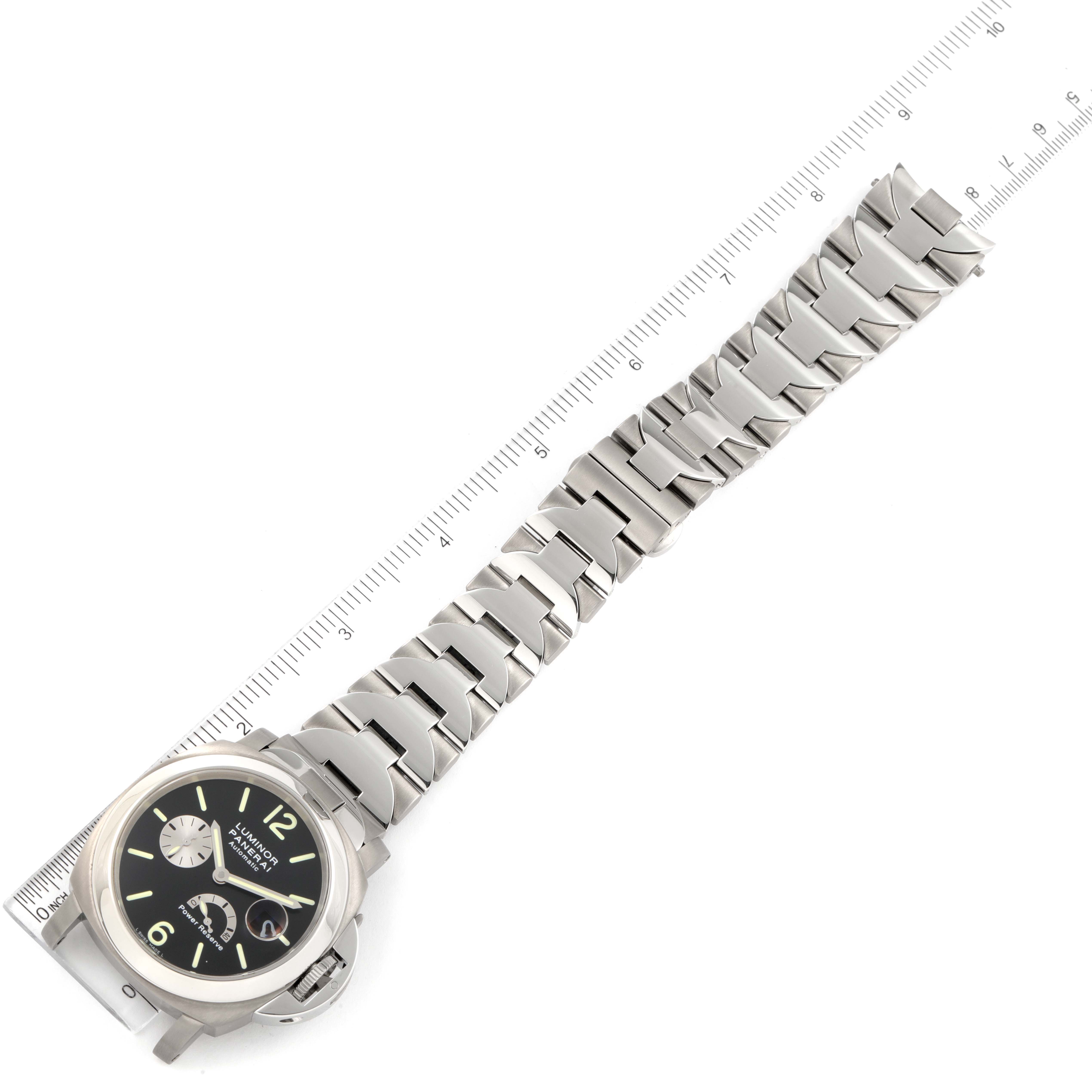 The image shows a top view of a Panerai Luminor PAM00171 Men's Titanium Black Dial PAM00171 Men's Titanium Black Dial watch, featuring its stainless steel bracelet and black dial, with a ruler for scale.