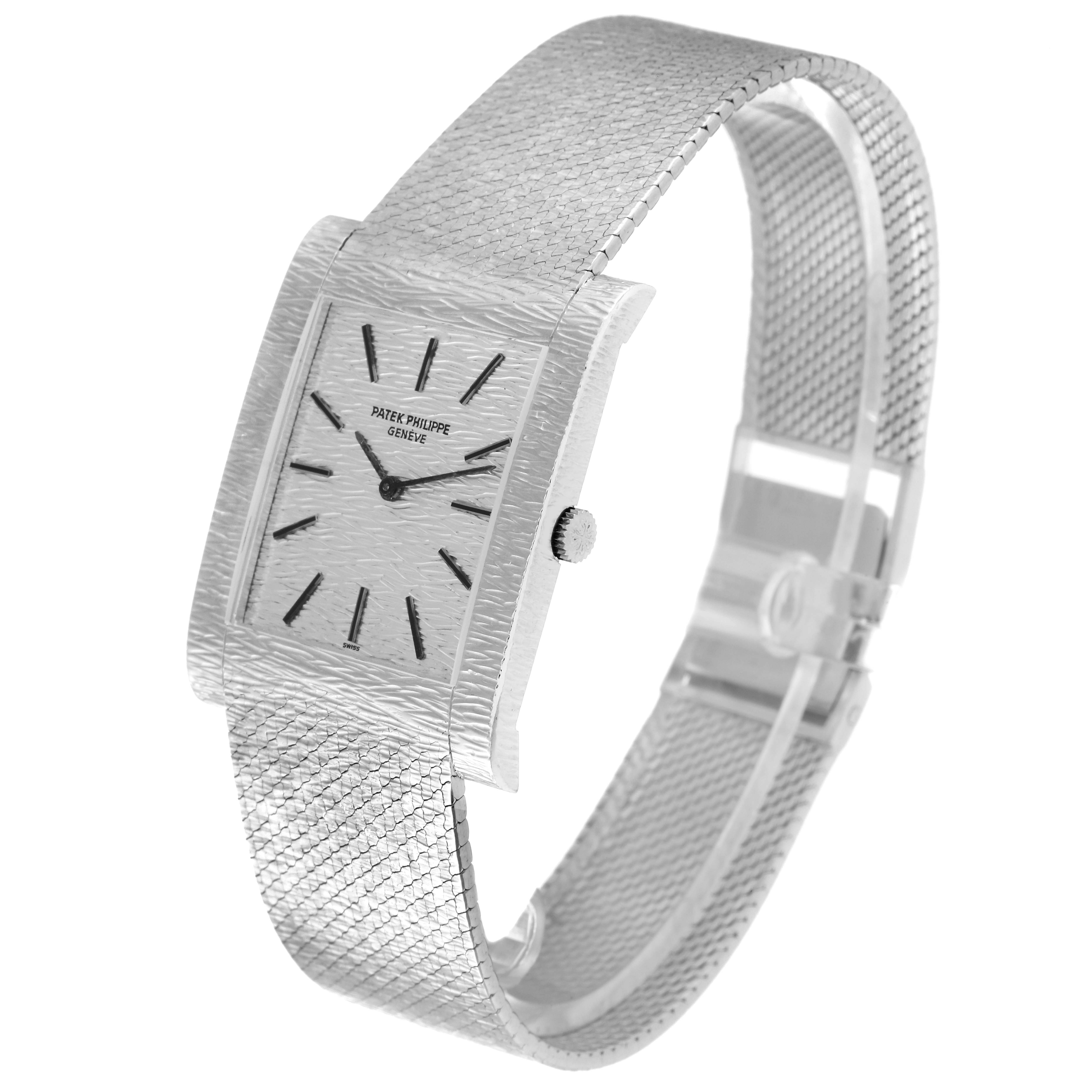 This image shows a side and front angle of the Patek Philippe Vintage 3553/1 Men
s White Gold Silver Dial 3553/1 Men
s White Gold Silver Dial watch, highlighting its rectangular face and textured bracelet.