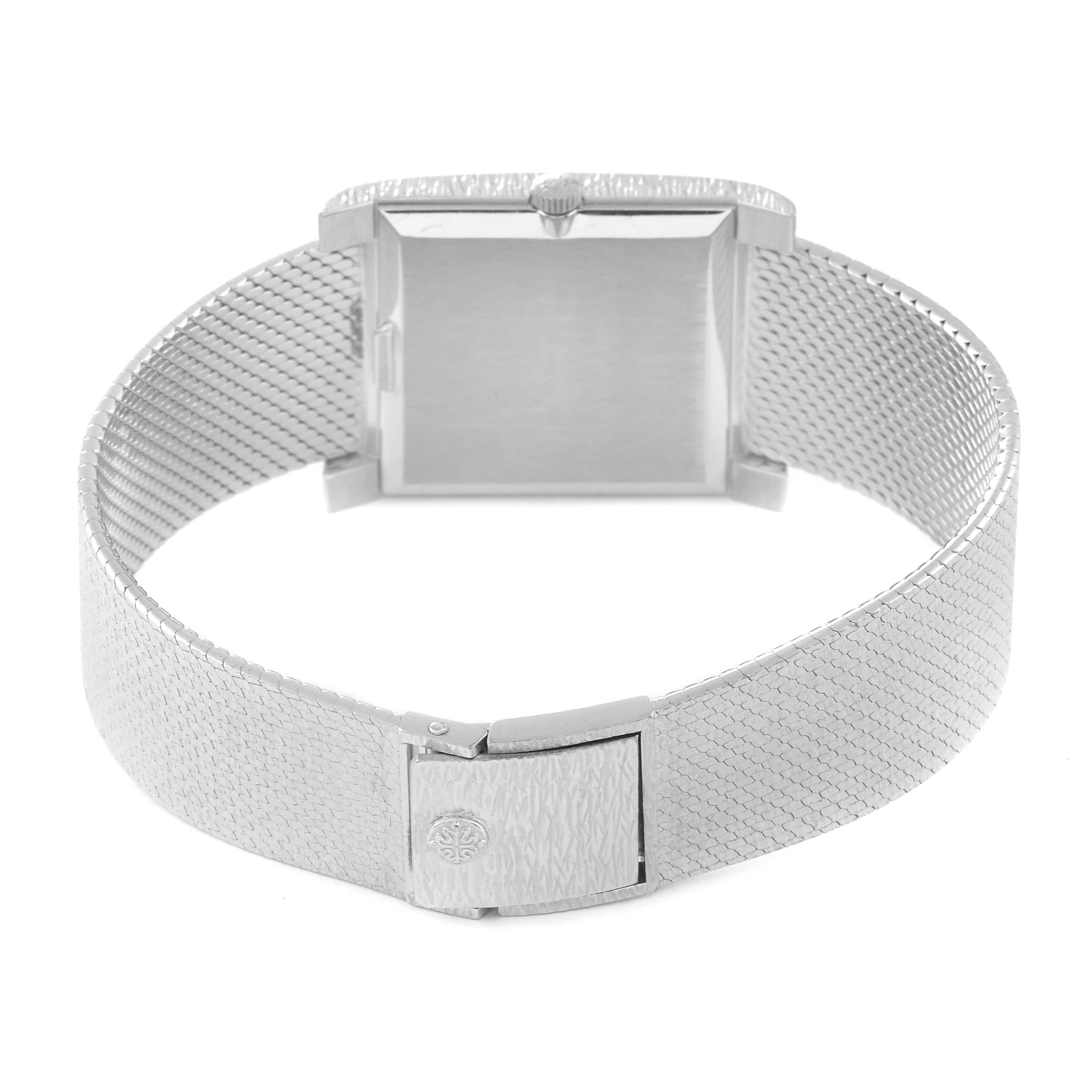 The image shows the back view of a Vintage Patek Philippe watch, highlighting the clasp, case back, and mesh bracelet.