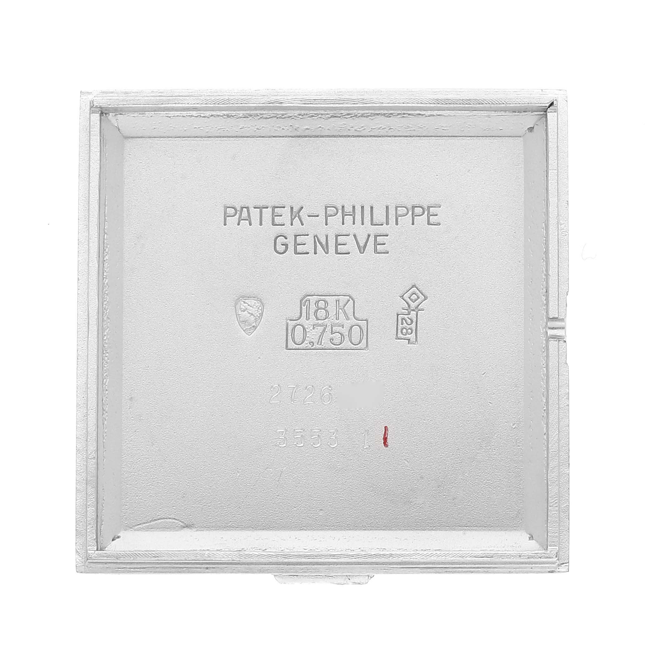 The image shows the inner case back of a Vintage Patek Philippe watch, stamped with markers including "18K 0.750."