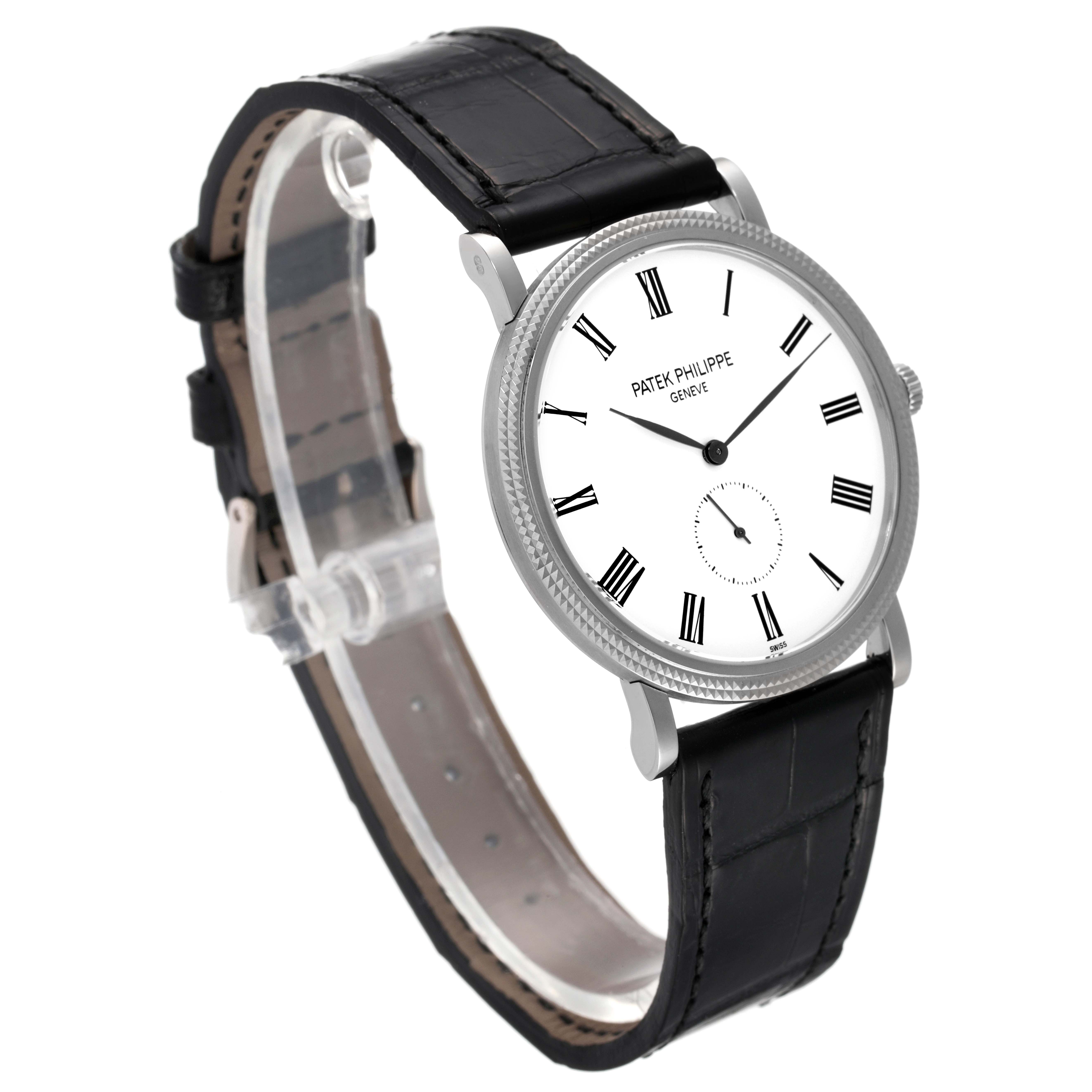The image shows a side angle of the Patek Philippe Calatrava 5119G Men
s White Gold White Dial 5119G Men
s White Gold White Dial watch, highlighting its dial, case, and black leather strap.