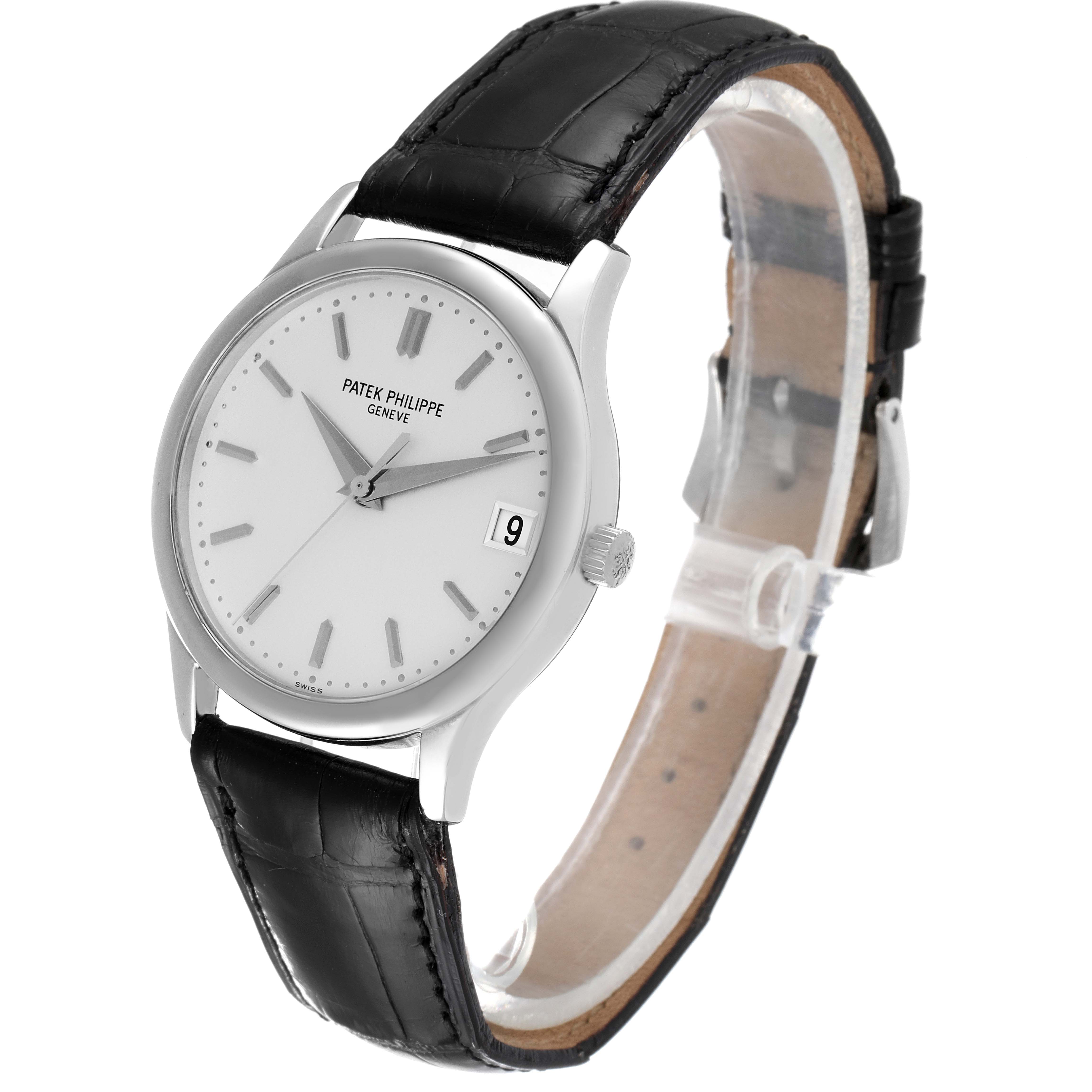 This image shows a Calatrava model by Patek Philippe at a three-quarter angle, displaying the watch face, case, and leather strap.