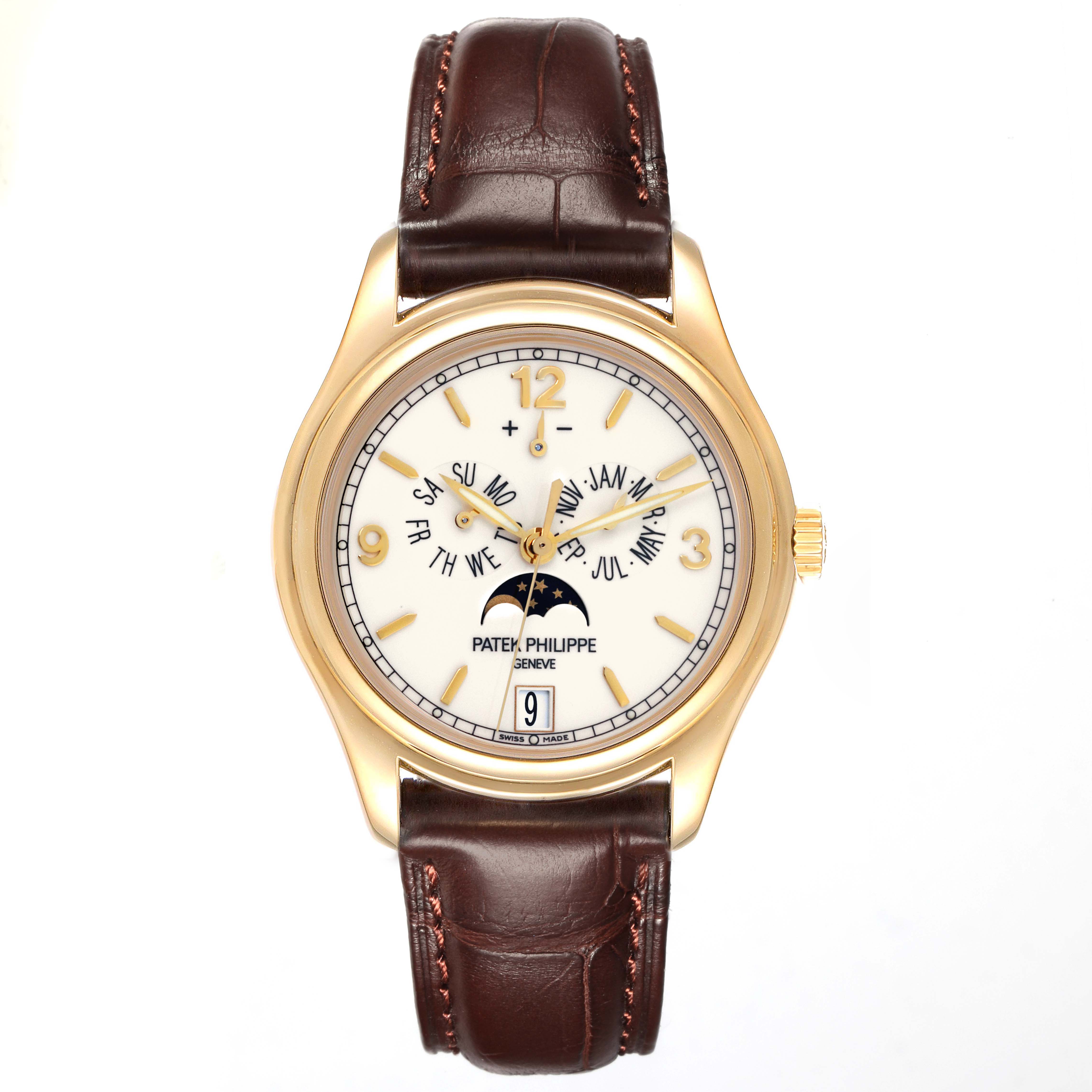 The Patek Philippe Complications 5146J Men's Yellow Gold Beige Dial 5146J Men's Yellow Gold Beige Dial watch is shown from a straight-on angle, highlighting the dial, gold case, and brown leather strap.