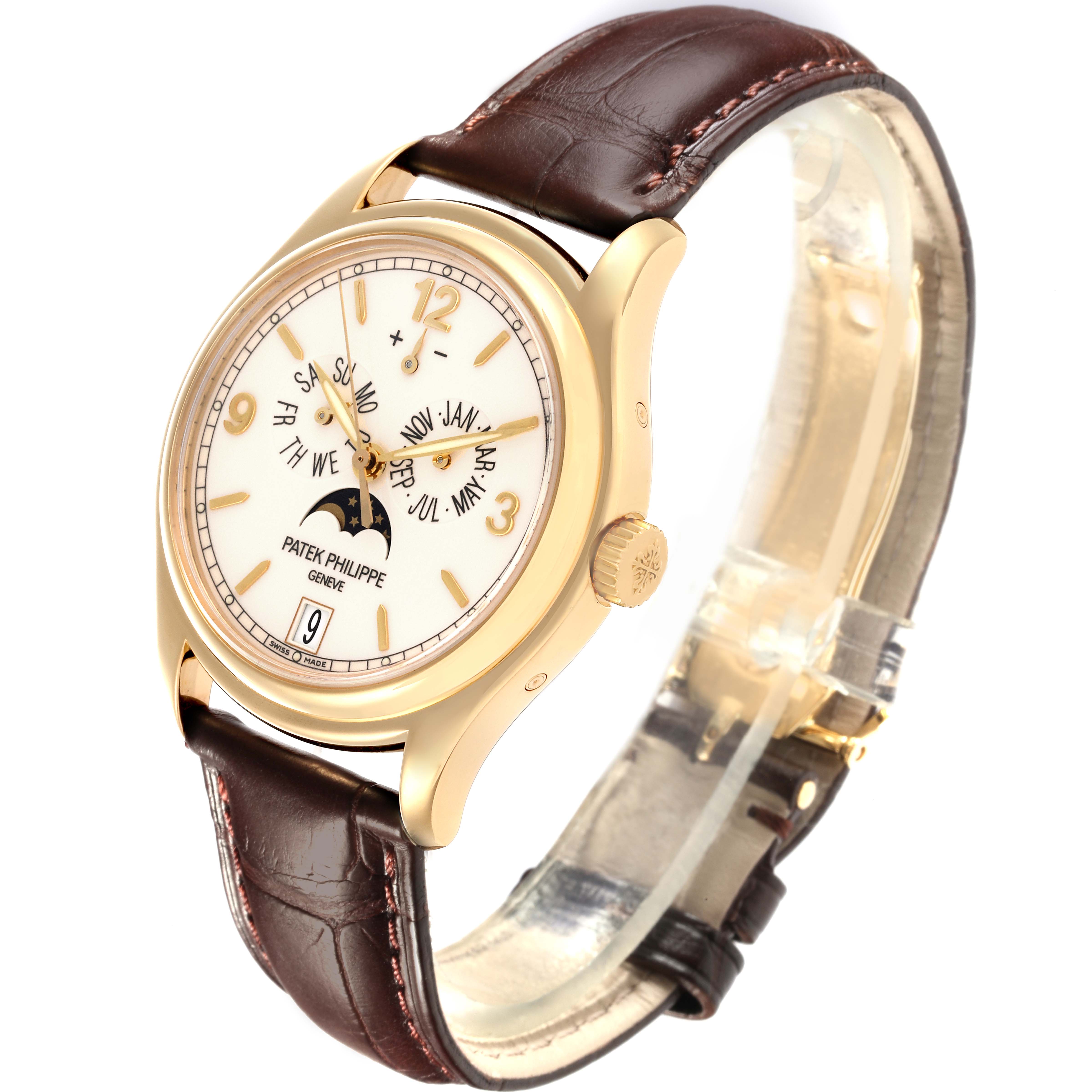 The Patek Philippe Complications 5146J Men's Yellow Gold Beige Dial 5146J Men's Yellow Gold Beige Dial watch is shown at a three-quarter angle, highlighting the dial, case, crown, and leather strap.
