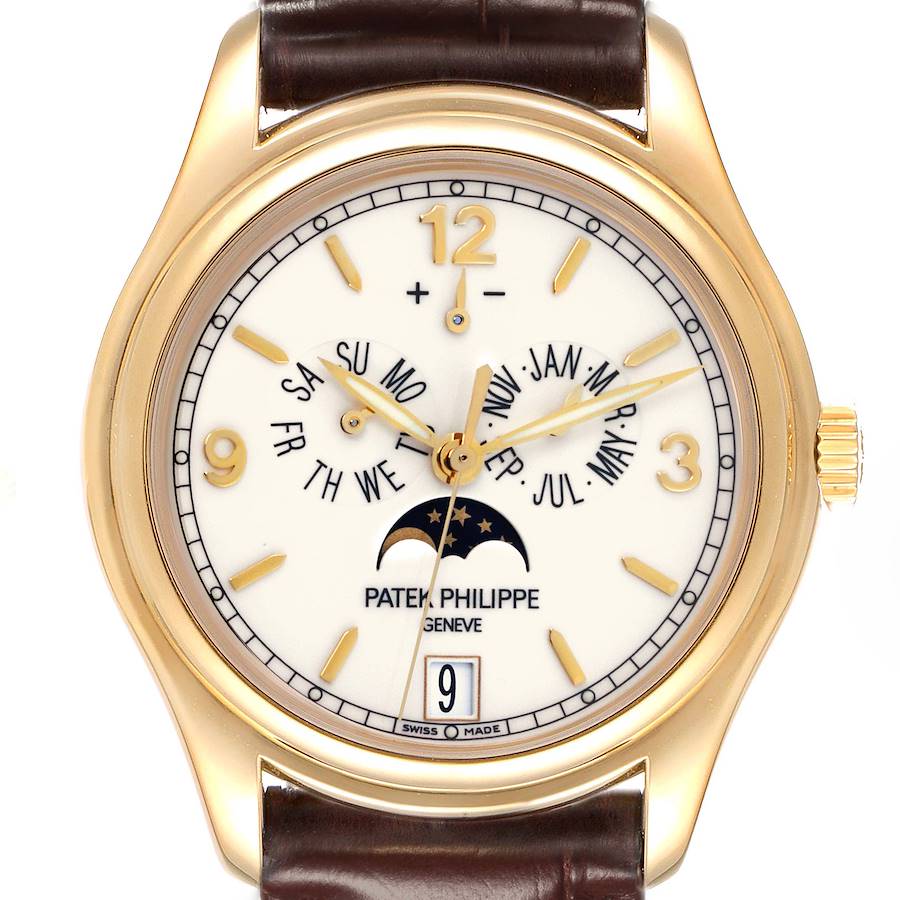 The Patek Philippe Complications watch is shown from a frontal angle, displaying its dial, moon phase, and calendar complications.