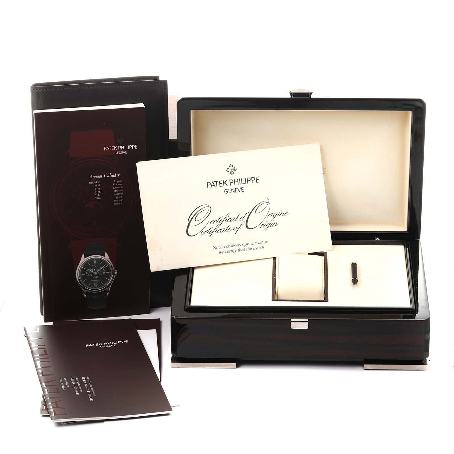 The image shows the packaging, certificate, manual, and box for a Patek Philippe Complications 5146J Men's Yellow Gold Beige Dial 5146J Men's Yellow Gold Beige Dial watch, without the watch itself.
