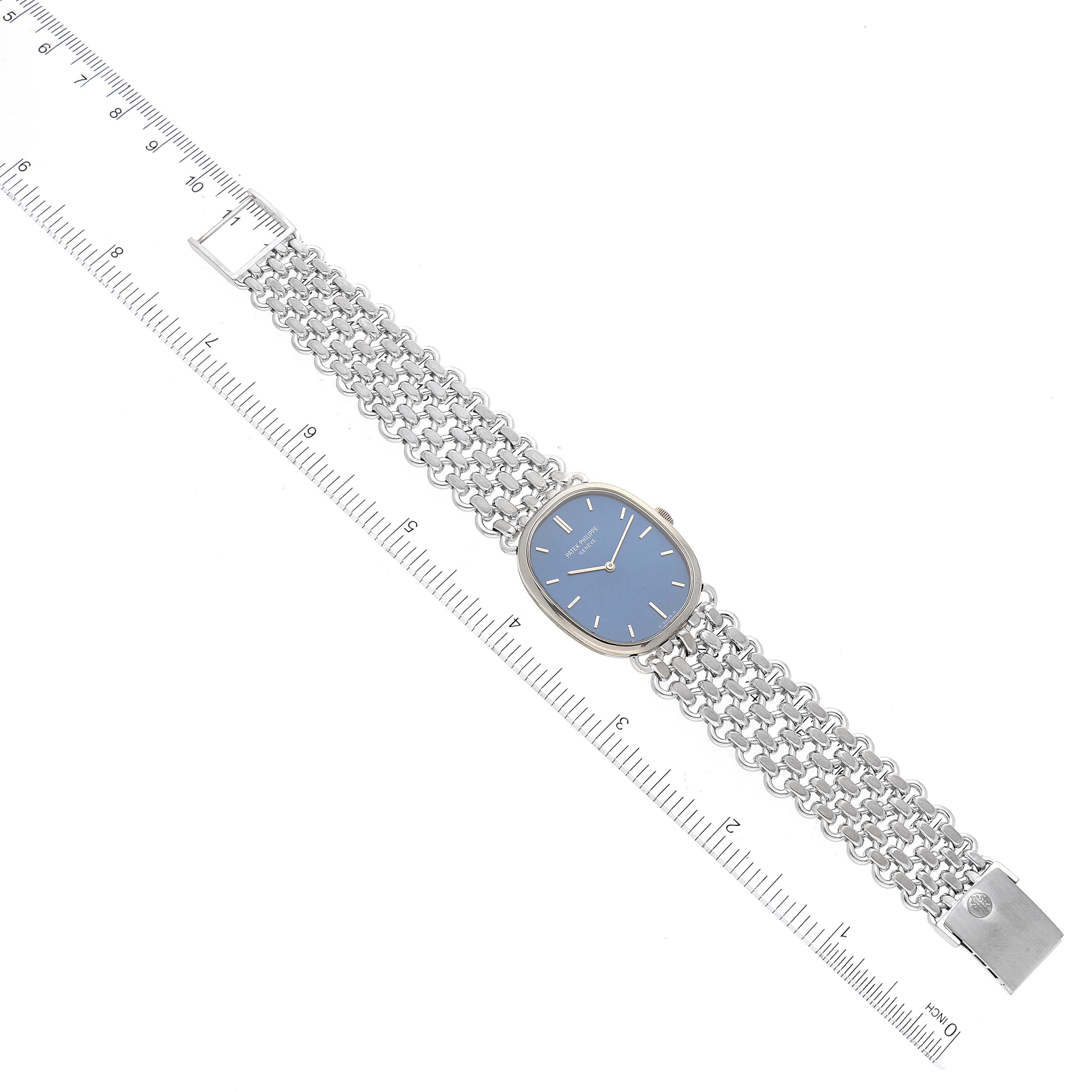 The image shows a full frontal view of a Vintage Patek Philippe watch with a mesh bracelet alongside a ruler for scale.