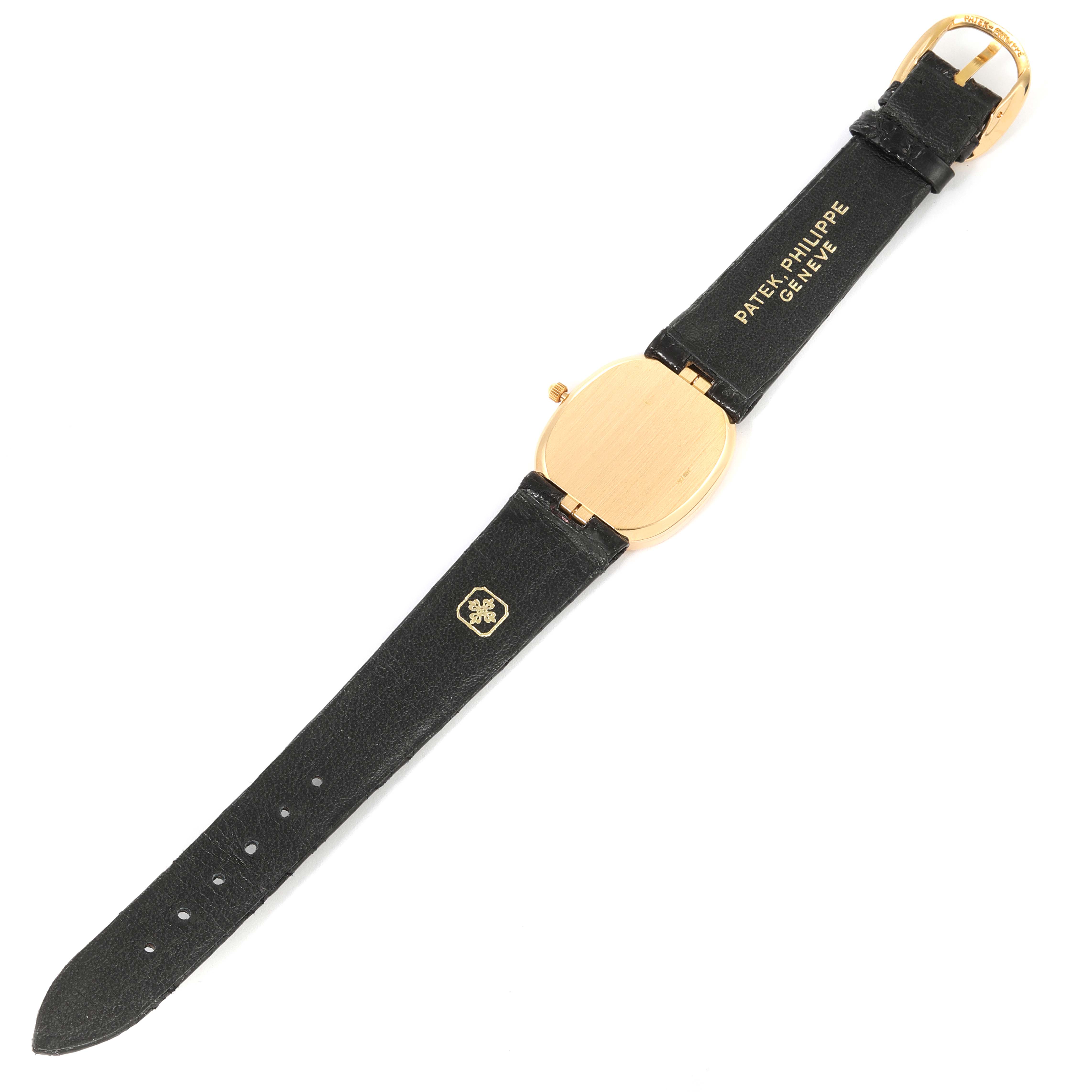 The image shows the back view of a Patek Philippe Golden Ellipse 3788 Men's Yellow Gold Beige Dial 3788 Men's Yellow Gold Beige Dial watch with its black leather strap fully extended.