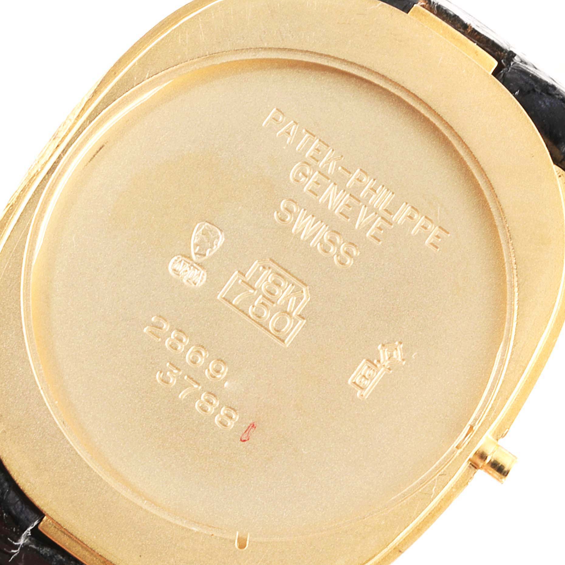 The image shows the back case of the Patek Philippe Golden Ellipse 3788 Men's Yellow Gold Beige Dial 3788 Men's Yellow Gold Beige Dial watch, highlighting the engravings and gold material.