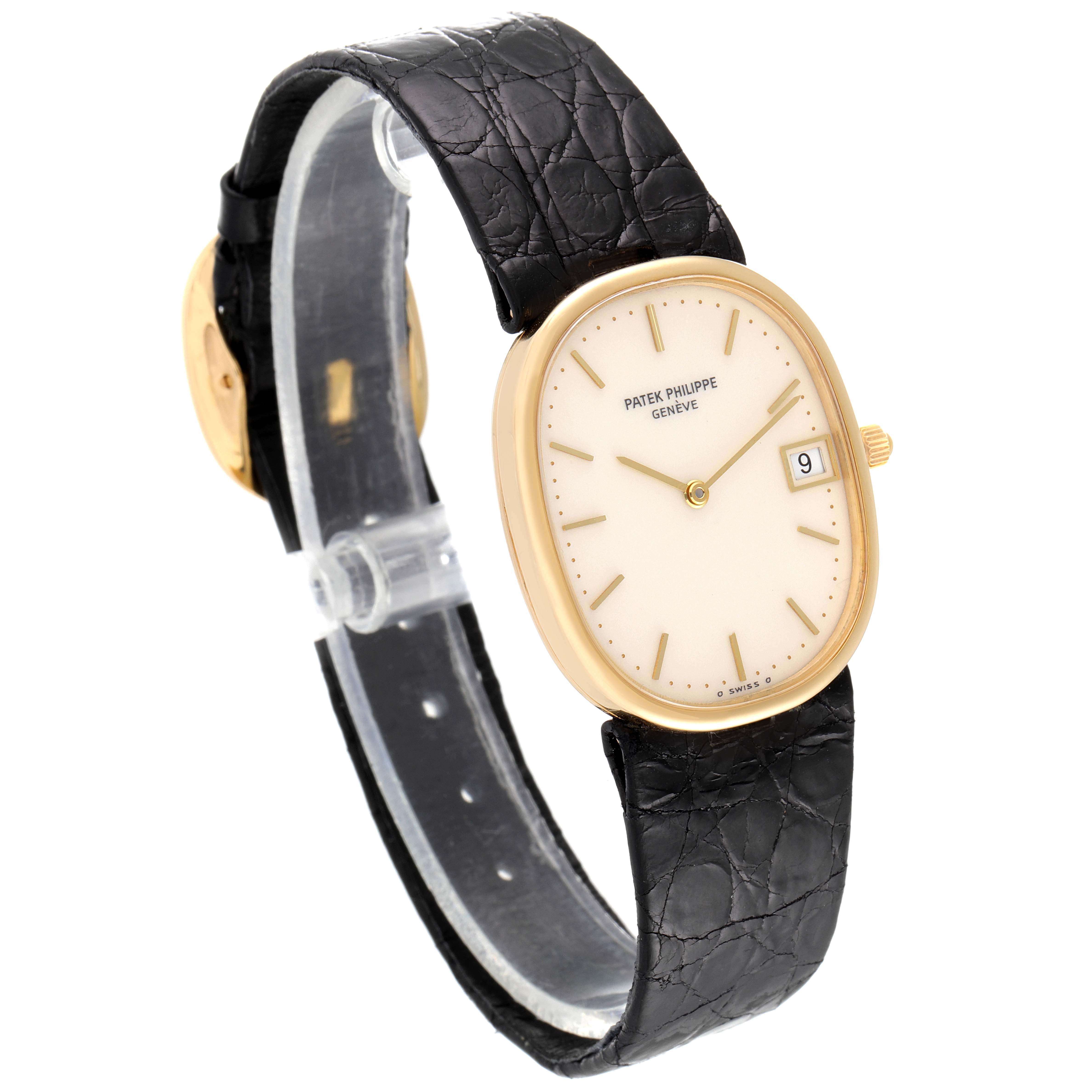 The image shows a side angle of the Patek Philippe Golden Ellipse 3788 Men's Yellow Gold Beige Dial 3788 Men's Yellow Gold Beige Dial watch, highlighting the face, bezel, crown, and black leather strap.