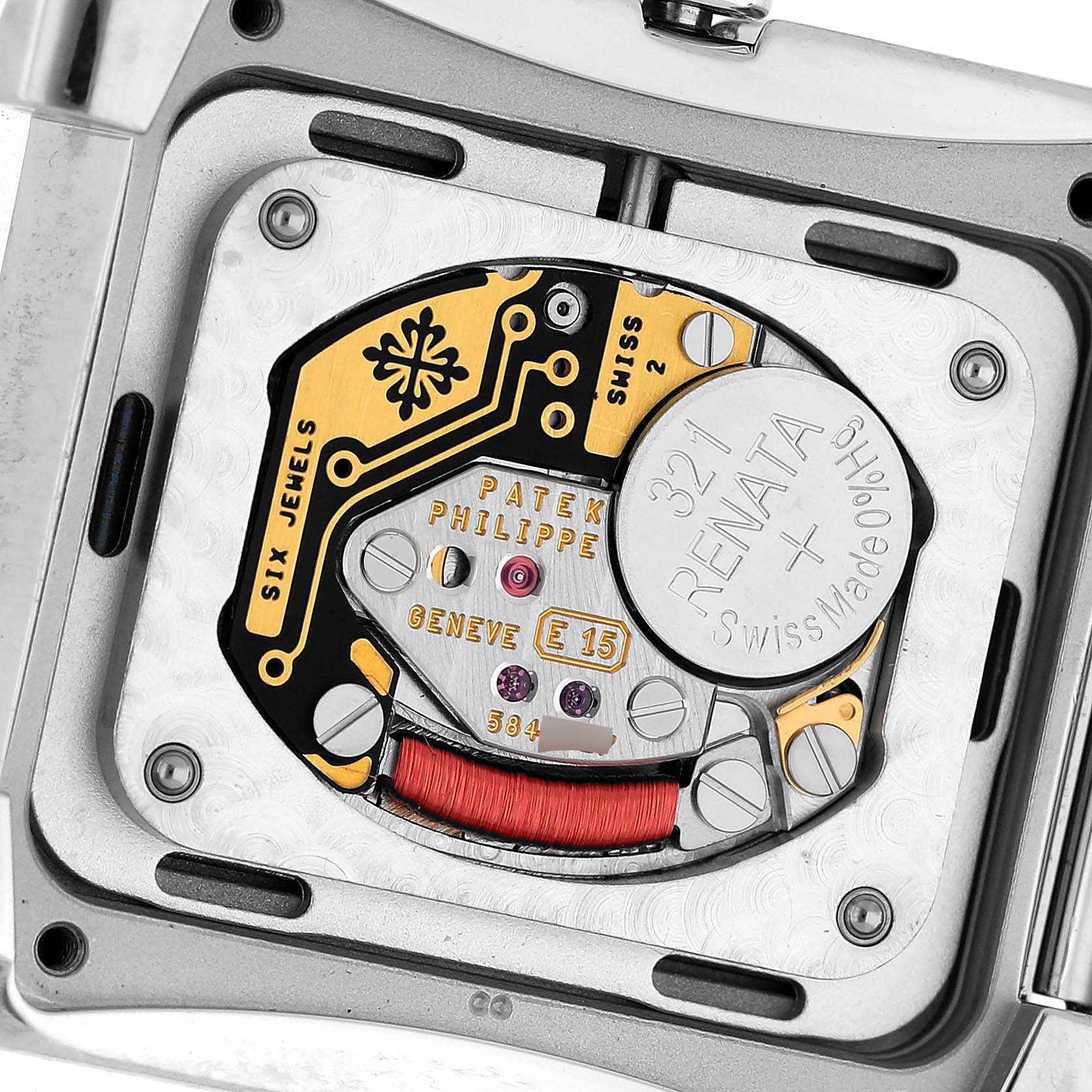 The image shows the back of a Patek Philippe Twenty-4 4910/10A-012 Women's Stainless Steel Blue Dial 4910/10A-012 Women's Stainless Steel Blue Dial model, highlighting the exposed movement and battery compartment.