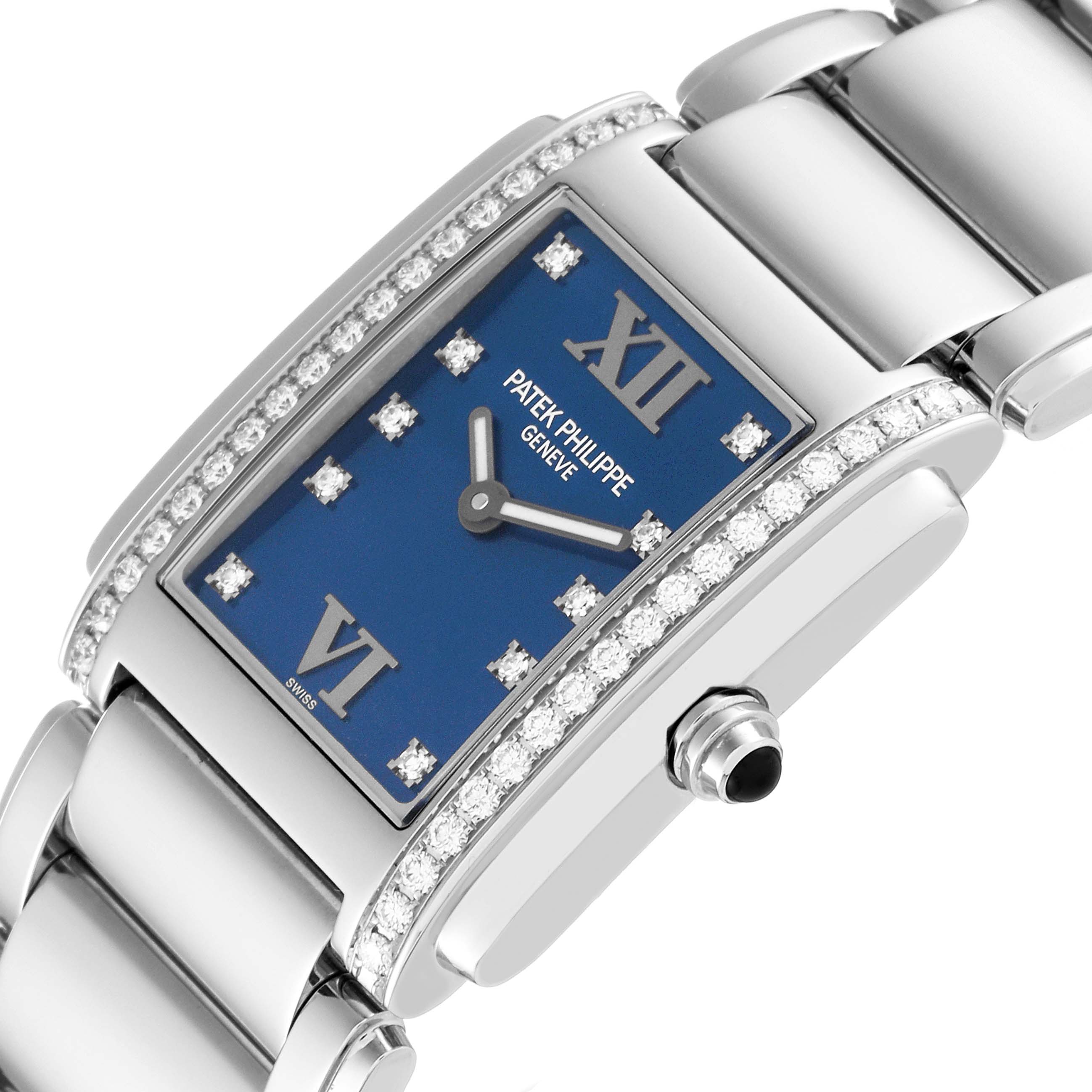 This image shows a close-up angle of the Twenty-4 model watch by Patek Philippe, featuring its blue dial, diamond bezel, and part of the bracelet.