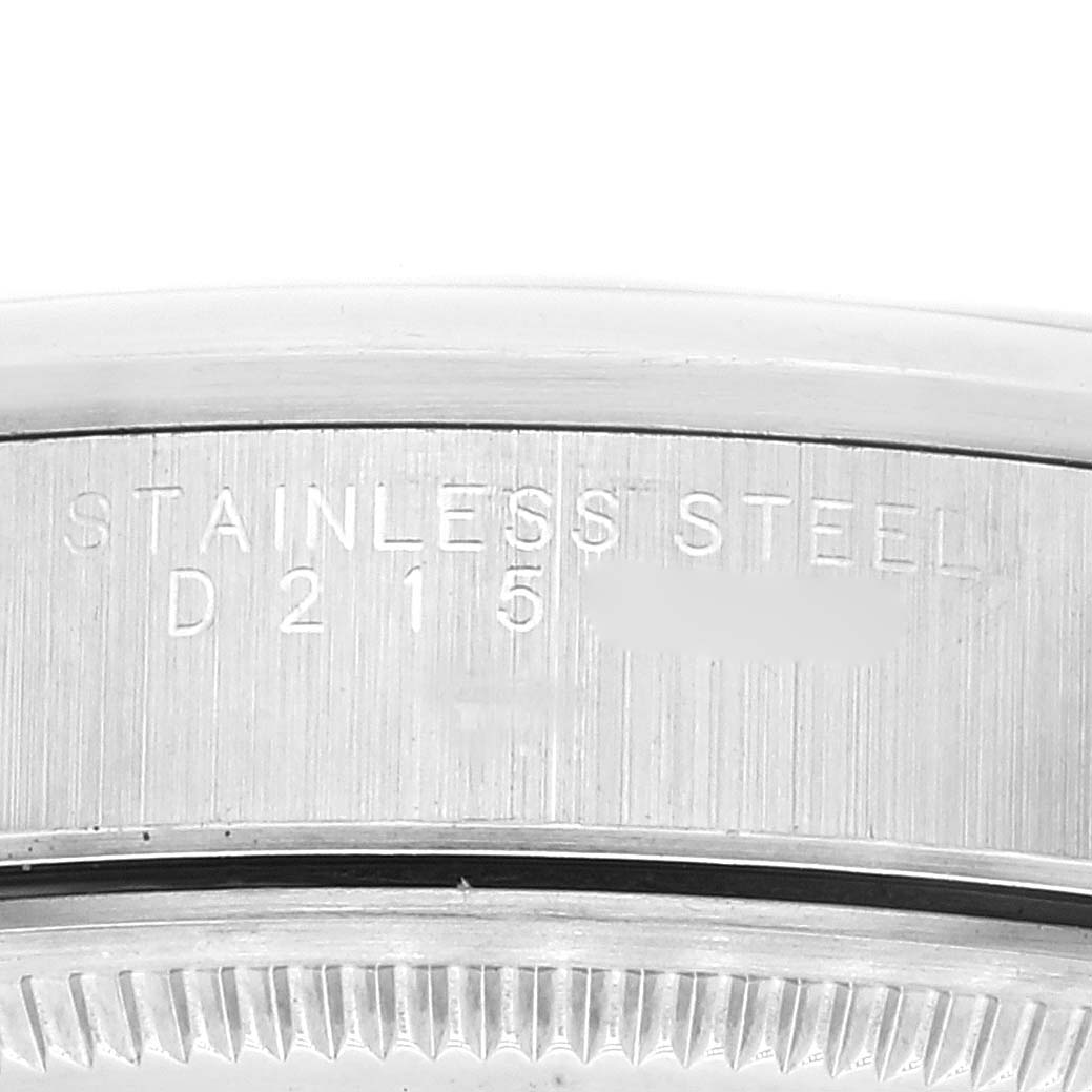 This image shows the side view of the Rolex Air-King 14000 Men's Stainless Steel Pink Dial 14000 Men's Stainless Steel Pink Dial's watch case with the stainless steel engravings.