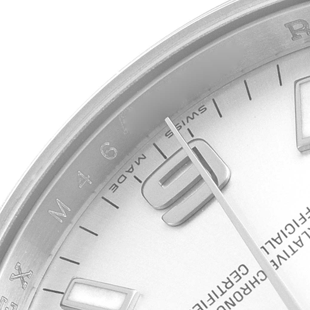 This close-up angle of the Rolex Air-King 114200 Men's Stainless Steel Silver Dial 114200 Men's Stainless Steel Silver Dial watch shows the dial, hour markers, and part of the minute hand.