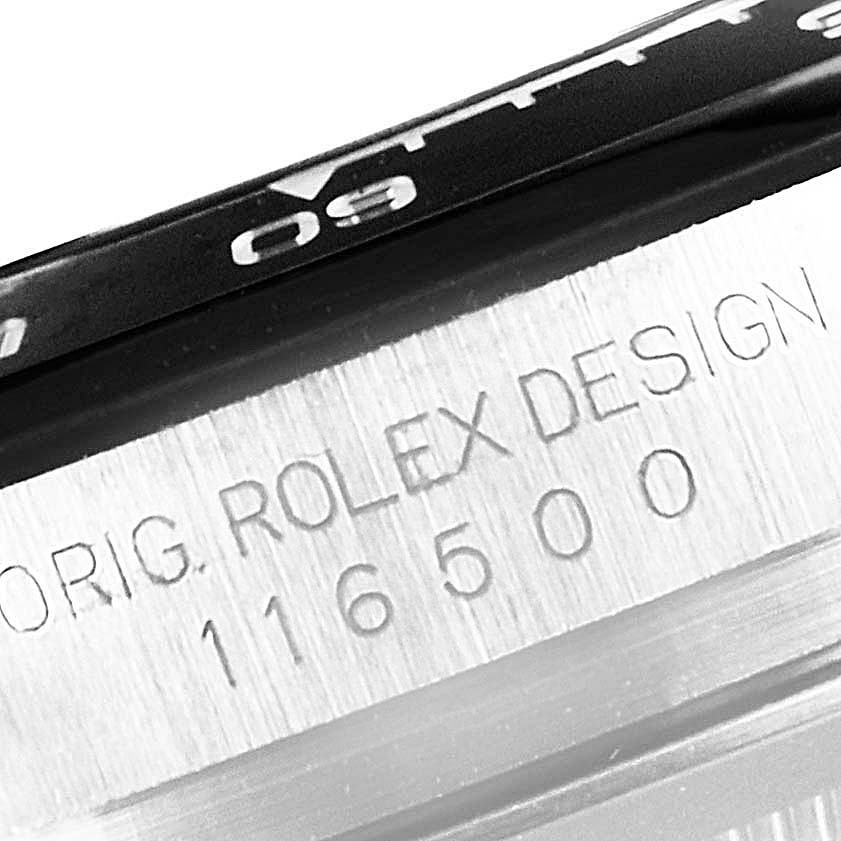 This close-up image shows the engraved model number and "ORIG. ROLEX DESIGN" on the case of a Rolex Daytona 116500 Men
s Stainless Steel Black Dial 116500 Men
s Stainless Steel Black Dial watch.