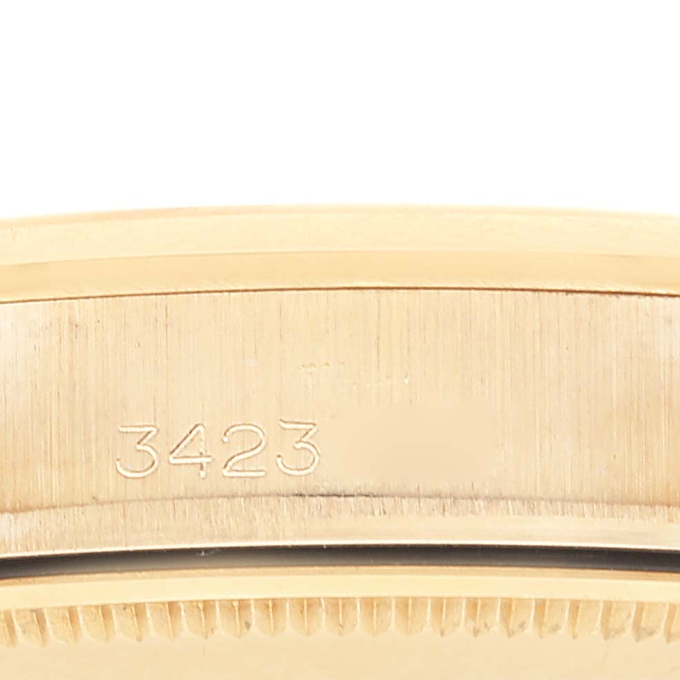 This image shows a side view of the casing with the serial number engraved on the Rolex Vintage Collection 1500 Men's Yellow Gold Champagne Dial 1500 Men's Yellow Gold Champagne Dial watch.