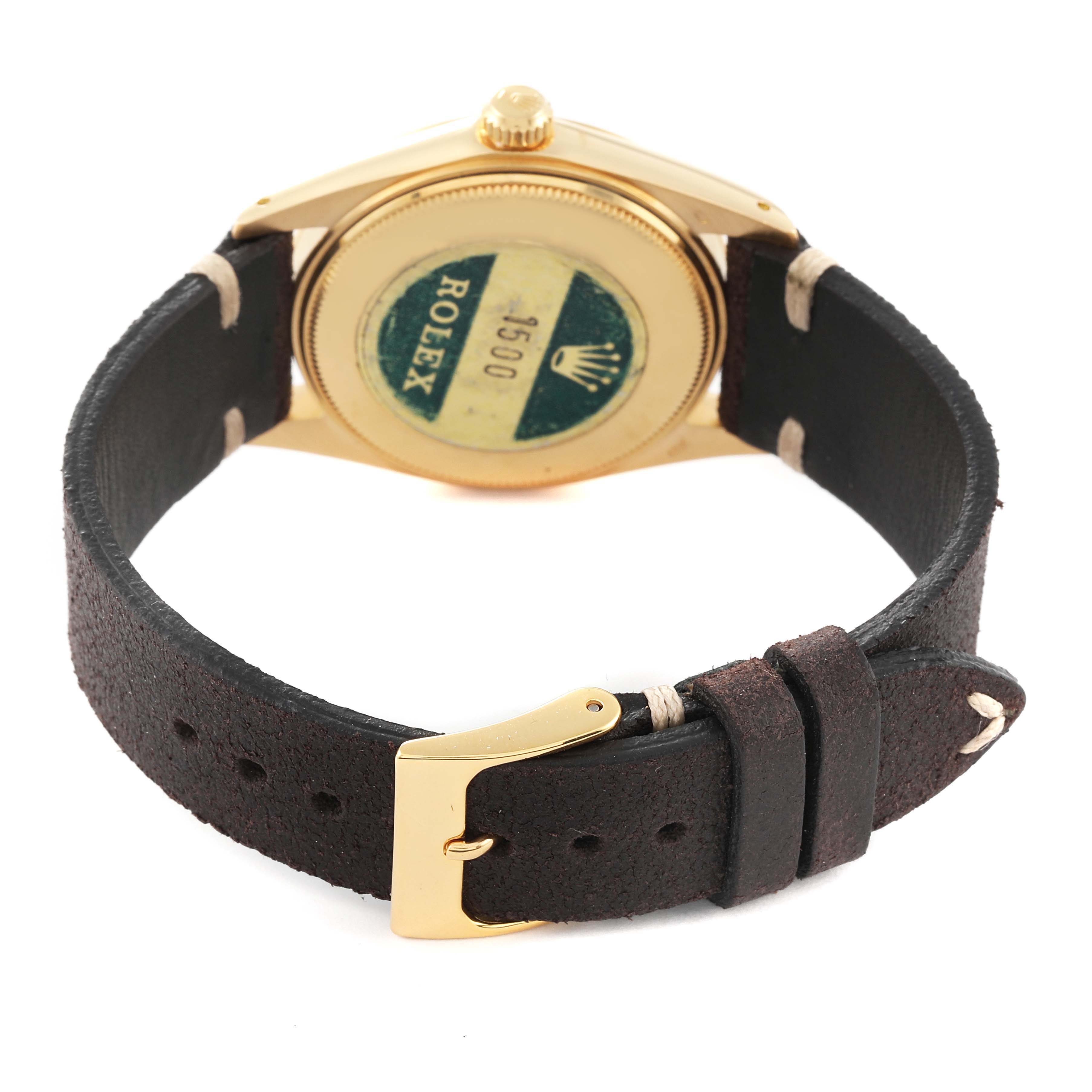 The image shows the back case and leather strap of a Vintage Collection Rolex watch, specifically the model 1500.