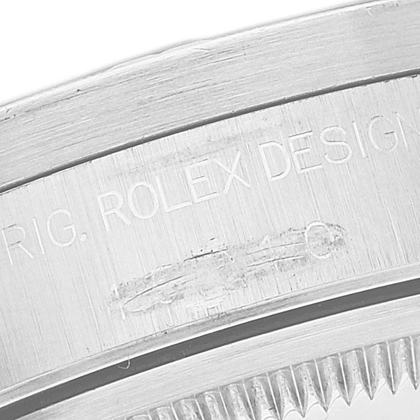 This close-up image shows the engraved detail on the casing of a Rolex Date 15210 Men
s Stainless Steel Black Dial 15210 Men
s Stainless Steel Black Dial model watch.