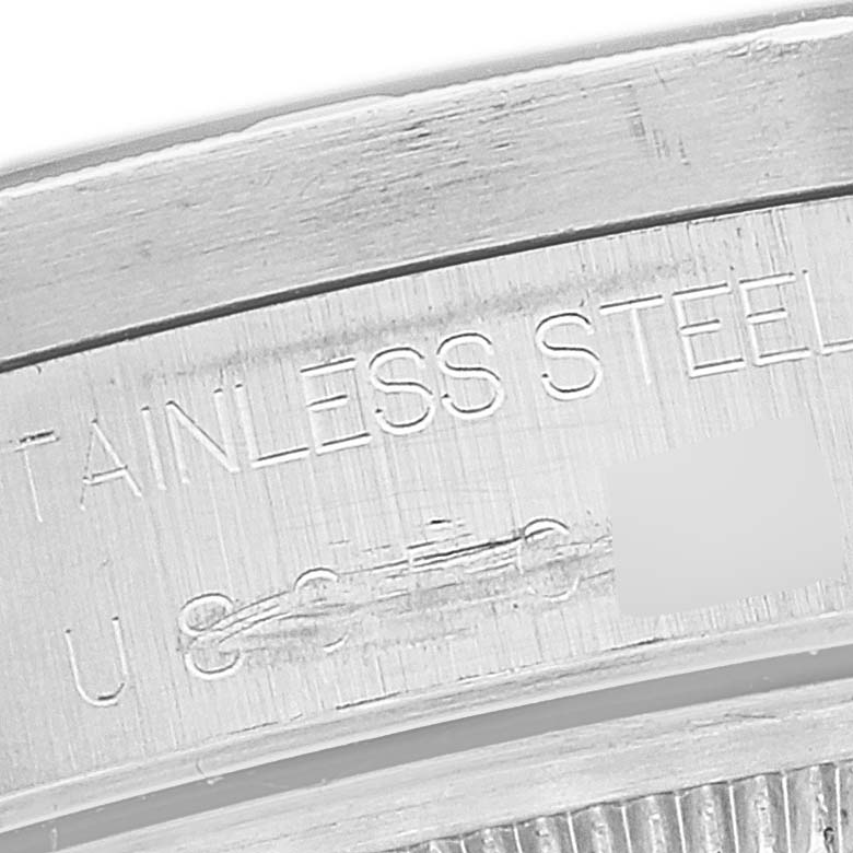 The angle shows a close-up of the inner case back of the Rolex Date 15210 Men
s Stainless Steel Black Dial 15210 Men
s Stainless Steel Black Dial watch, highlighting the "STAINLESS STEEL" engraving.