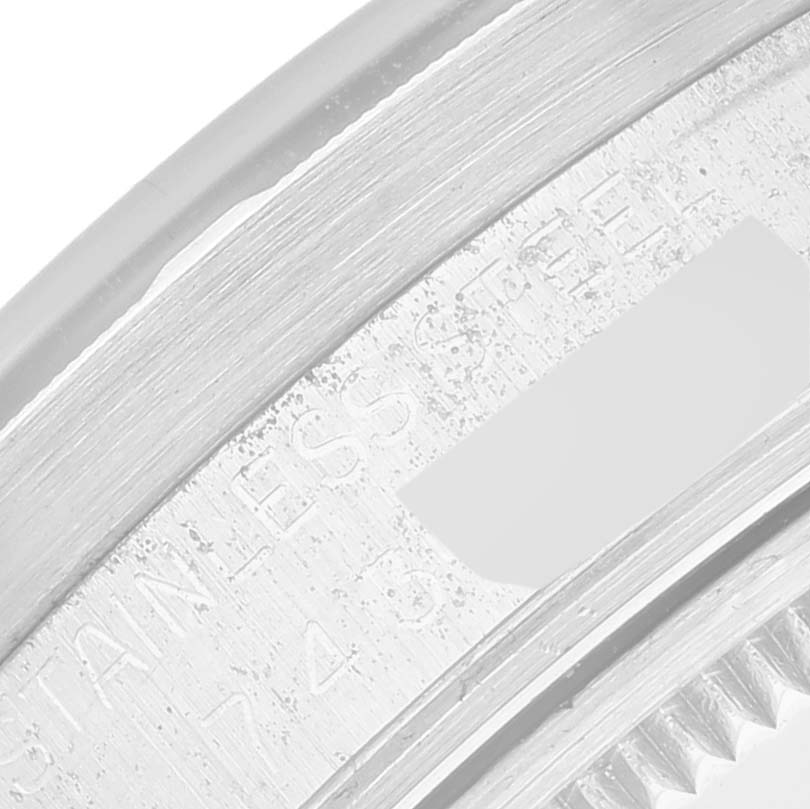 This close-up image showcases the engraved side of the case and bezel of a Rolex Vintage Collection 15010 Men's Stainless Steel Silver Dial 15010 Men's Stainless Steel Silver Dial watch.