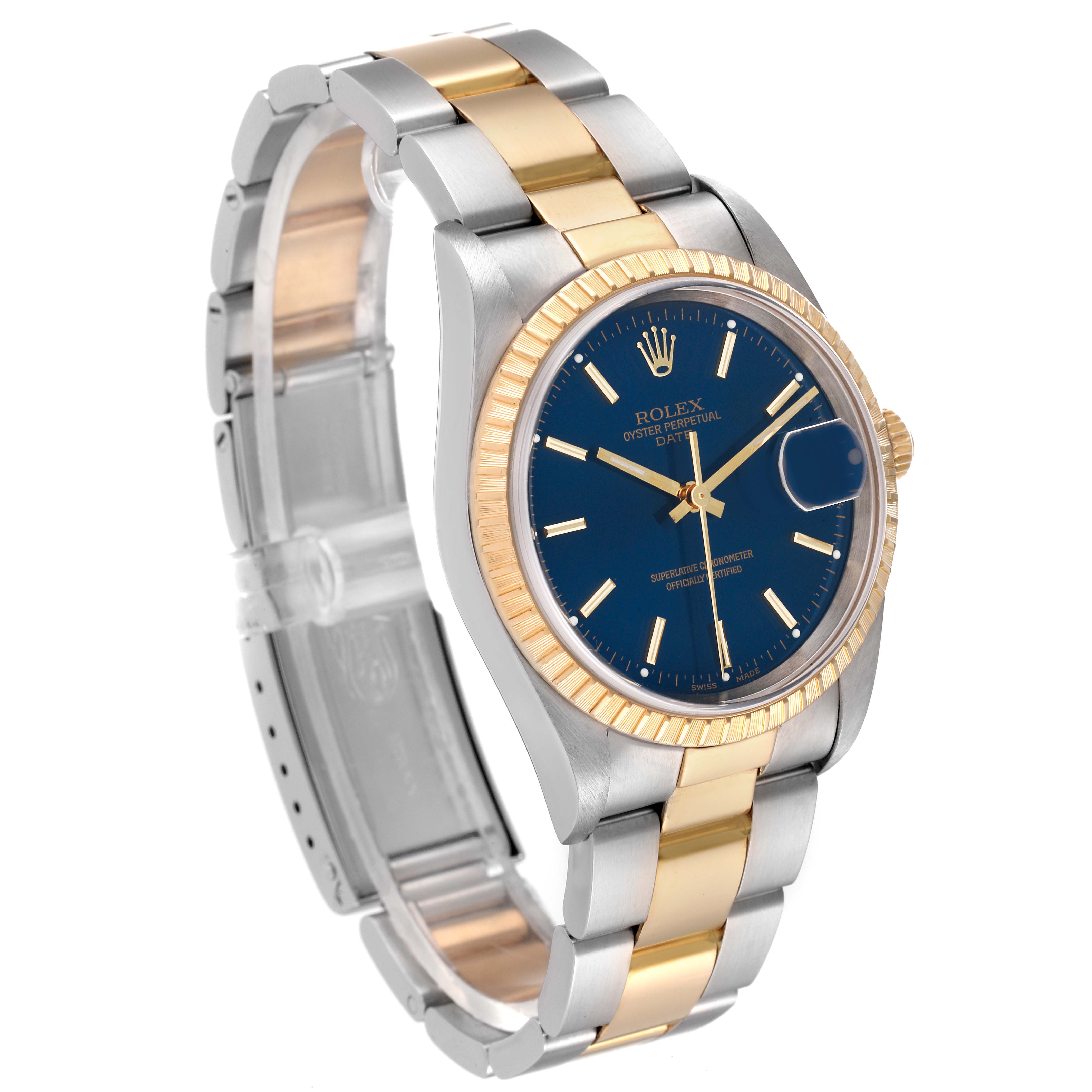 The image shows a Rolex Date 15223 Men
s Steel and Gold (two tone) Blue Dial 15223 Men
s Steel and Gold (two tone) Blue Dial with a blue dial, silver and gold bracelet, and fluted bezel at a three-quarter angle.
