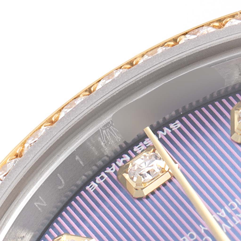 This close-up image of a Rolex Datejust 279383 Women's Steel and Gold (two tone) Purple Dial 279383 Women's Steel and Gold (two tone) Purple Dial watch shows the bezel, part of the dial, and diamond hour markers.