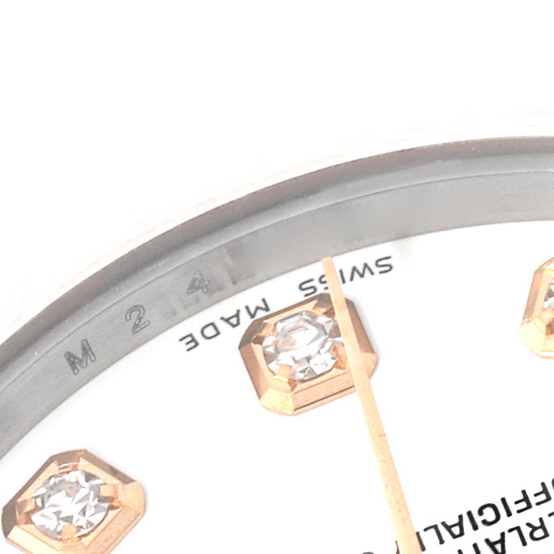 This close-up image of a Rolex Mid-Size 178271 Women's Steel and Gold (two tone) White Dial 178271 Women's Steel and Gold (two tone) White Dial watch shows part of the dial, bezel, diamond hour markers, and "Swiss Made" text.