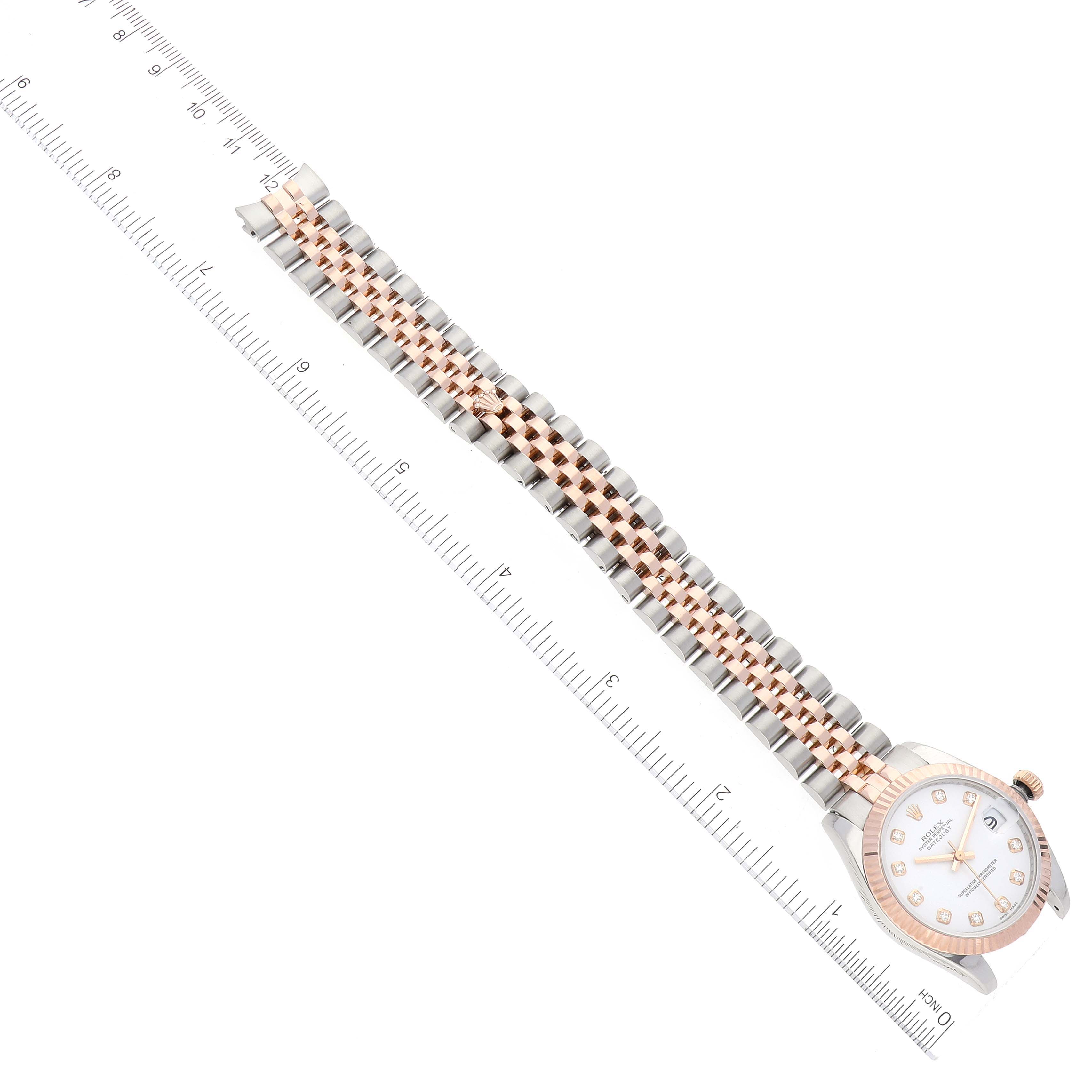 The image shows a top-down view of a Rolex Mid-Size 178271 Women's Steel and Gold (two tone) White Dial 178271 Women's Steel and Gold (two tone) White Dial watch, focusing on the entire watch and its bracelet.