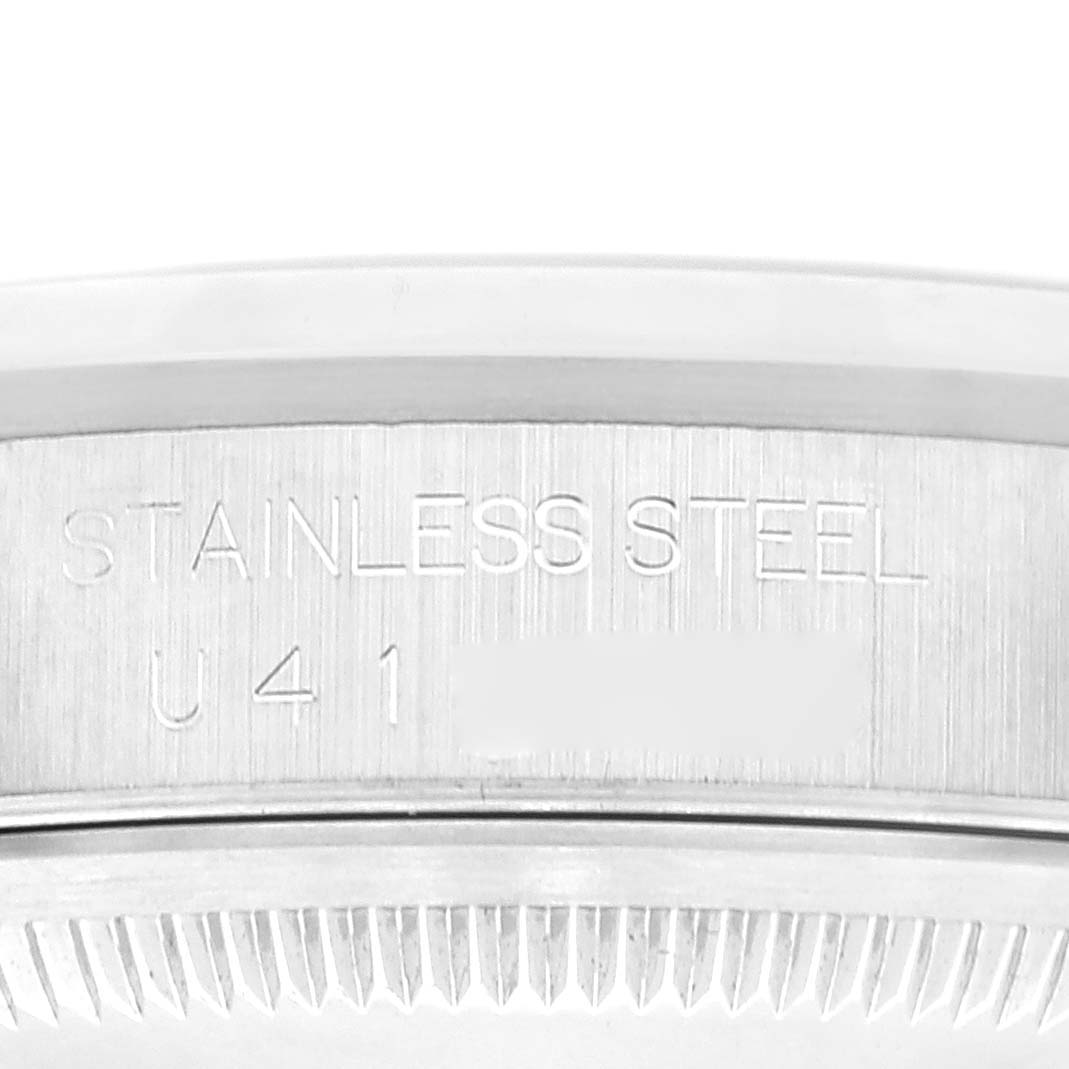 This image shows a close-up view of the case back with engravings on a Rolex Datejust 16200 Men's Stainless Steel Pink Dial 16200 Men's Stainless Steel Pink Dial watch.