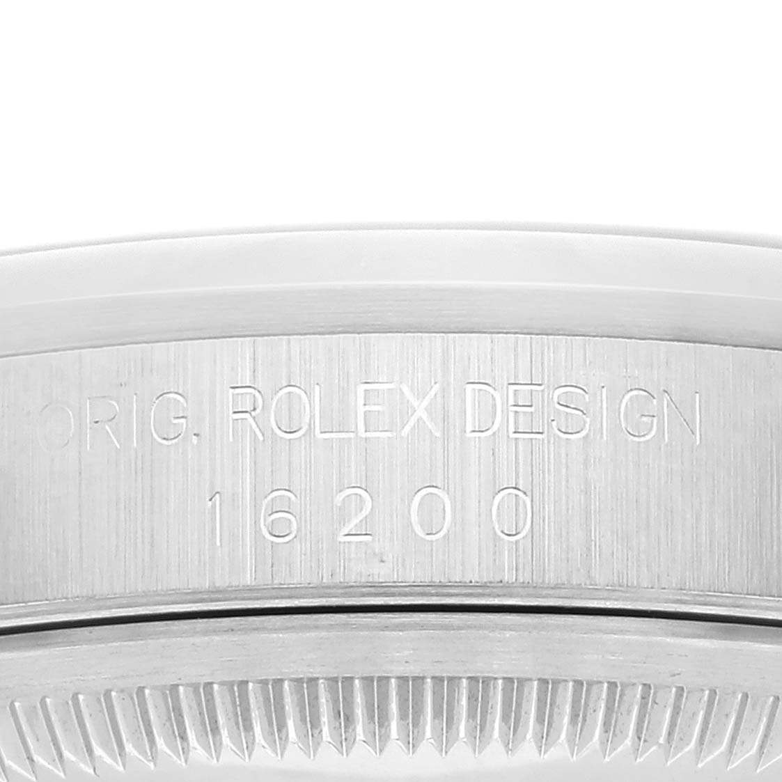 This close-up shows the engraved case side of a Rolex Datejust 16200 Men's Stainless Steel Pink Dial 16200 Men's Stainless Steel Pink Dial, model 16200, with "Orig. Rolex Design" marking.