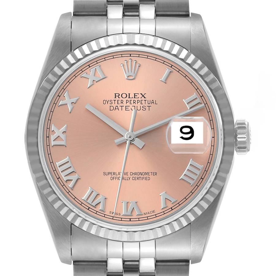 This image shows a full frontal view of a Rolex Datejust watch, featuring a pink dial with Roman numerals and a fluted bezel.